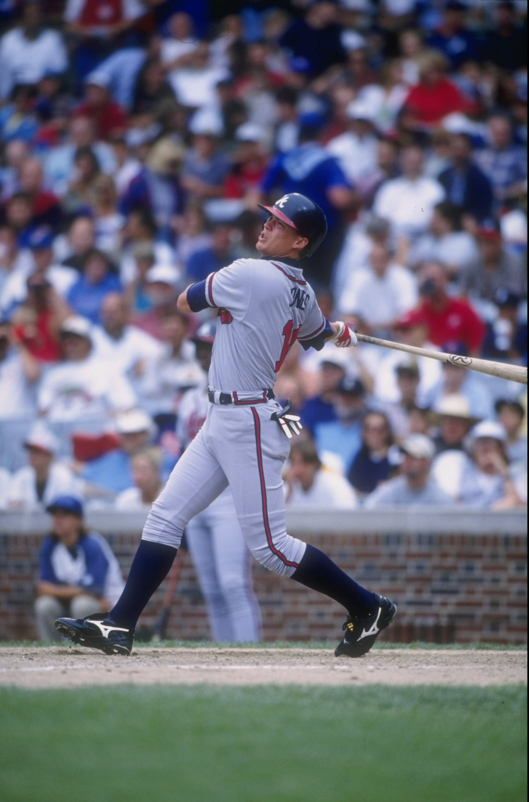 22 Jul 1997: Chipper Jones #10 of the Atlanta Braves in action during a game against the Chicago Cubs at Wrigley Field in Chicago, Illinois. The Braves defeated the Cubs 4-1.