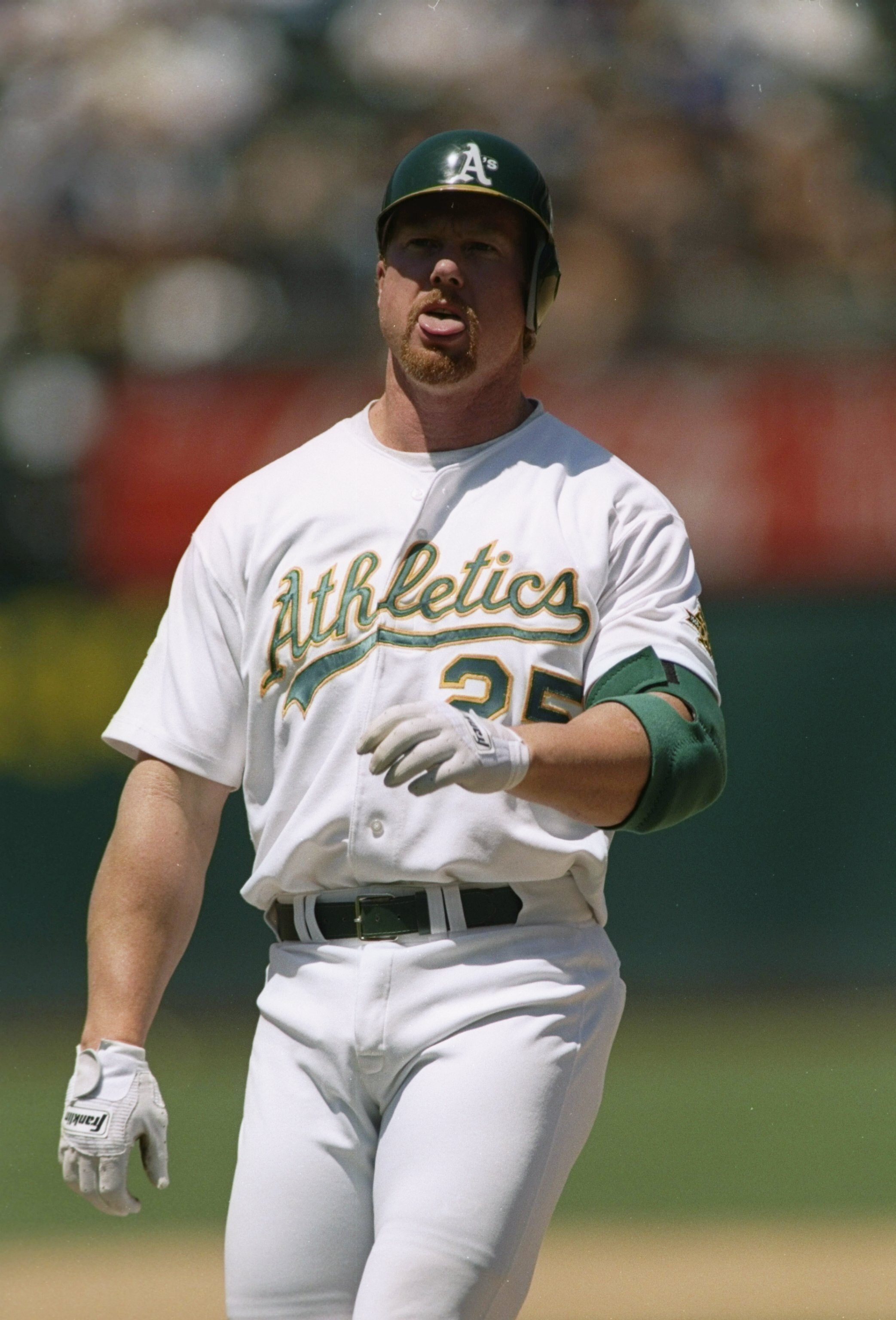 21 Jul 1997:  First baseman Mark McGwire of the Oakland Athletics looks on during a game against the Minnesota Twins at the Oakland Coliseum in Oakland, California.  Minnesota won the game 1-0. Mandatory Credit: Otto Greule  /Allsport