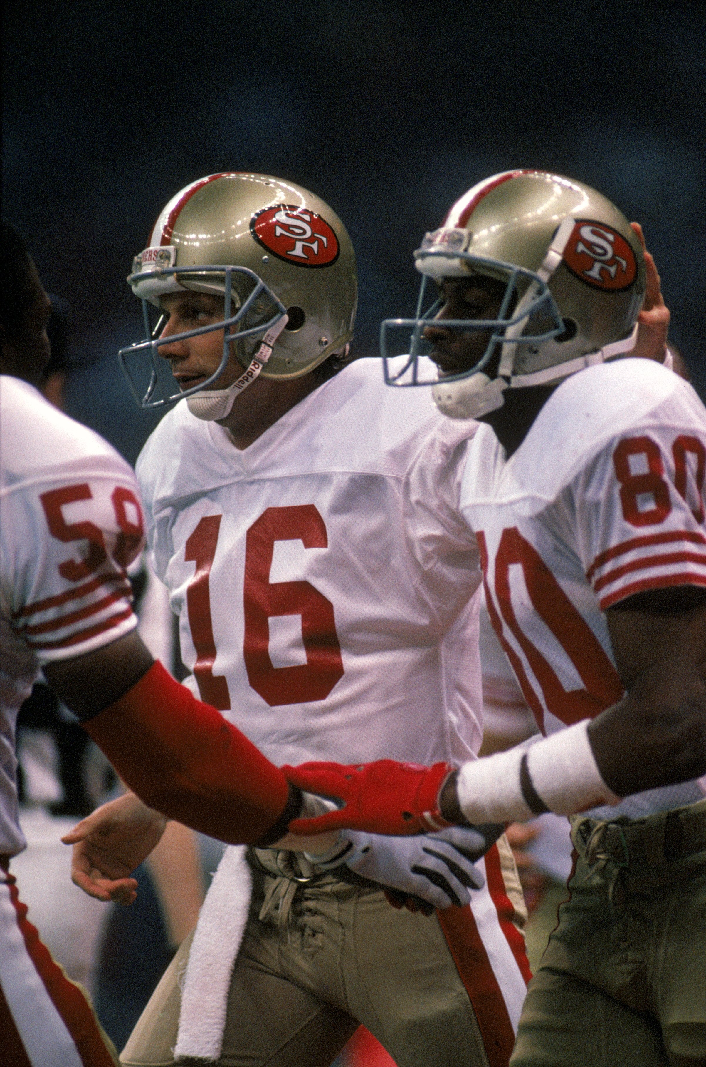 NEW ORLEANS - JANUARY 28:  Quarterback Joe Montana #16 and wide receiver Jerry Rice #80 of the San Francisco 49ers celebrate in Super Bowl XXIV against the Denver Broncos at Louisiana Superdome on January 28, 1990 in New Orleans, Louisiana.  The 49ers won
