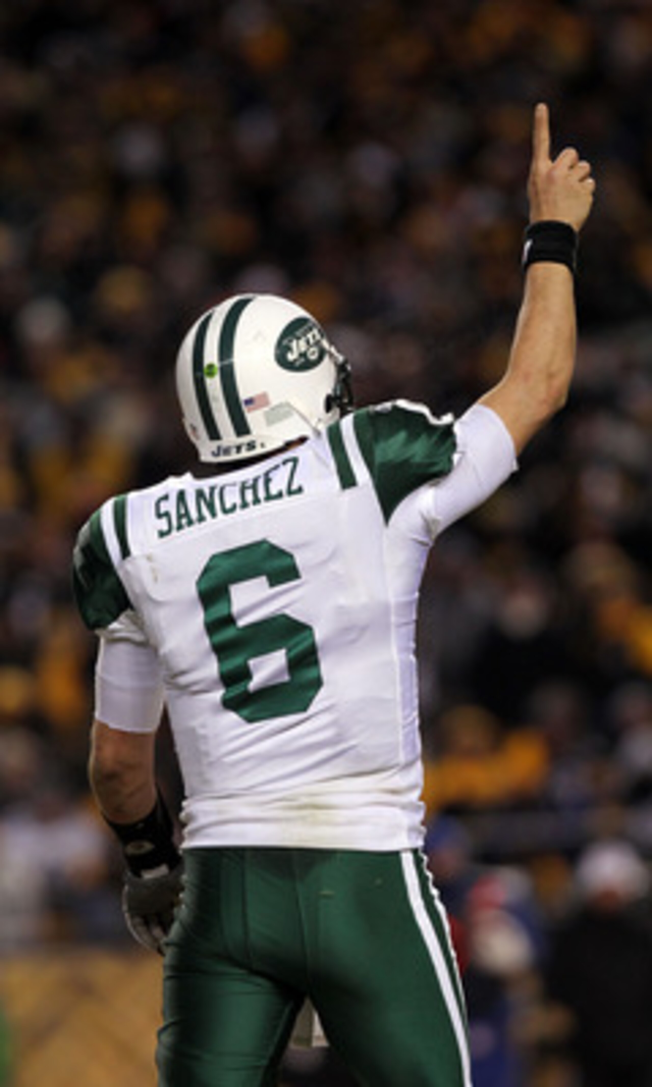 PITTSBURGH, PA - JANUARY 23:  Quarterback Mark Sanchez #6 of the New York Jets gestures after he threw a touchdown pas against the Pittsburgh Steelers during the 2011 AFC Championship game at Heinz Field on January 23, 2011 in Pittsburgh, Pennsylvania. Th