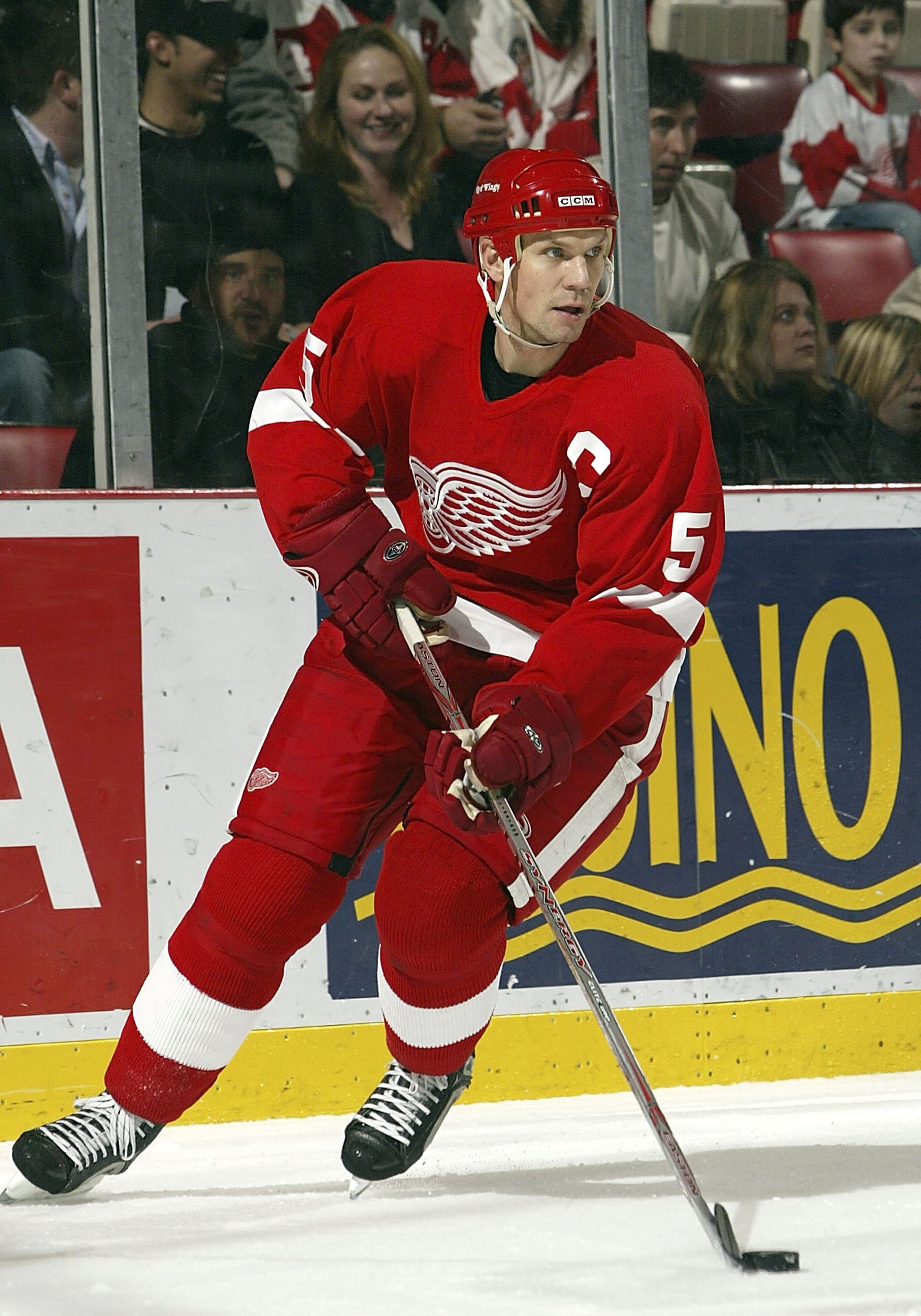 DETROIT - DECEMBER 22:  Nicklas Lidstrom #5 of the Detroit Red Wings carries the puck against the Minnesota Wild during their NHL game at Joe Louis Arena December 22, 2006 in Detroit, Michigan. The Red Wings beat the Wild 3-1.  (Photo by Dave Sandford/Get