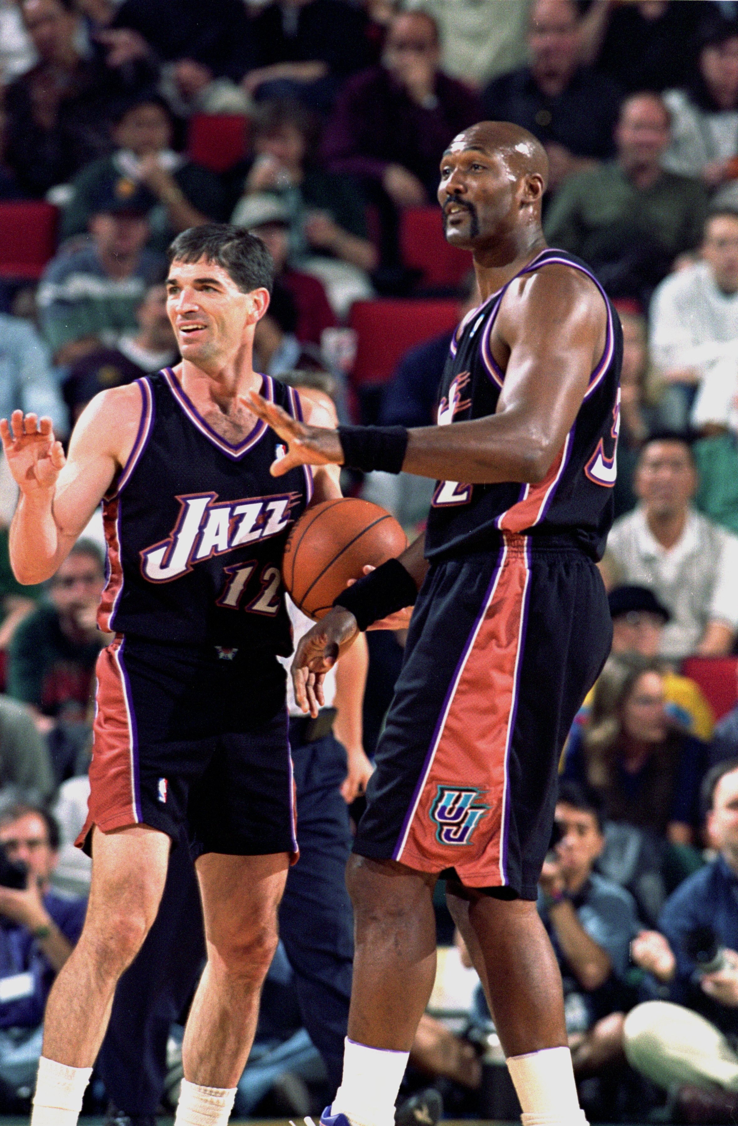 3 May 2000:   John Stockton #12 and Karl Malone #32 of the Utah Jazz make a hand gesture to some teamates during the NBA Western Conference Playoffs Round One Game against the Seattle SuperSonics at Key Arena in Seattle, Washington. The SuperSonics defeat