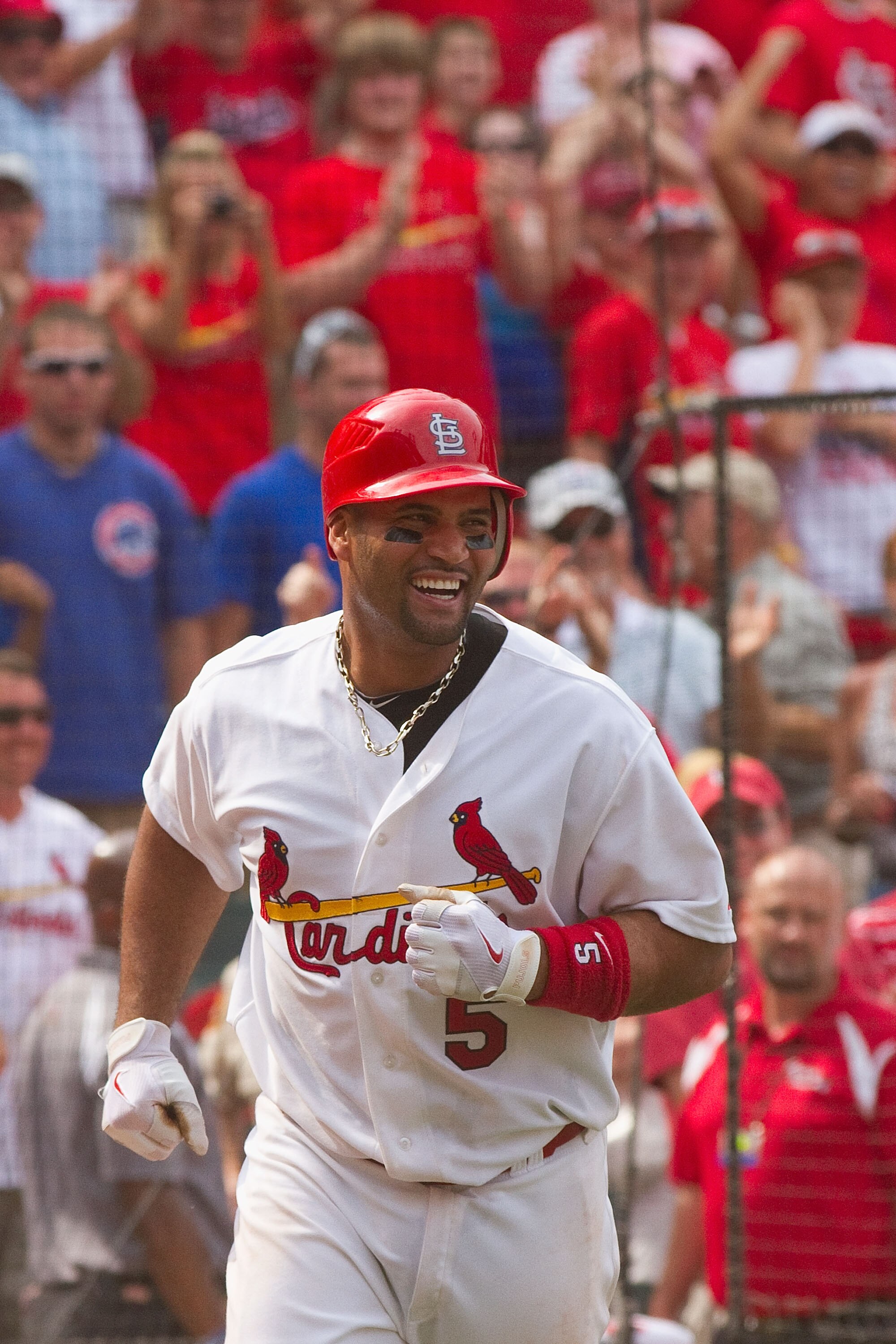 ST. LOUIS, MO - JUNE 5: Albert Pujols #5 of the St. Louis Cardinals celebrates his walk-off home run against the Chicago Cubs at Busch Stadium on June 5, 2011 in St. Louis, Missouri.  The Cardinals beat the Cubs 3-2 in 10 innings.  (Photo by Dilip Vishwan