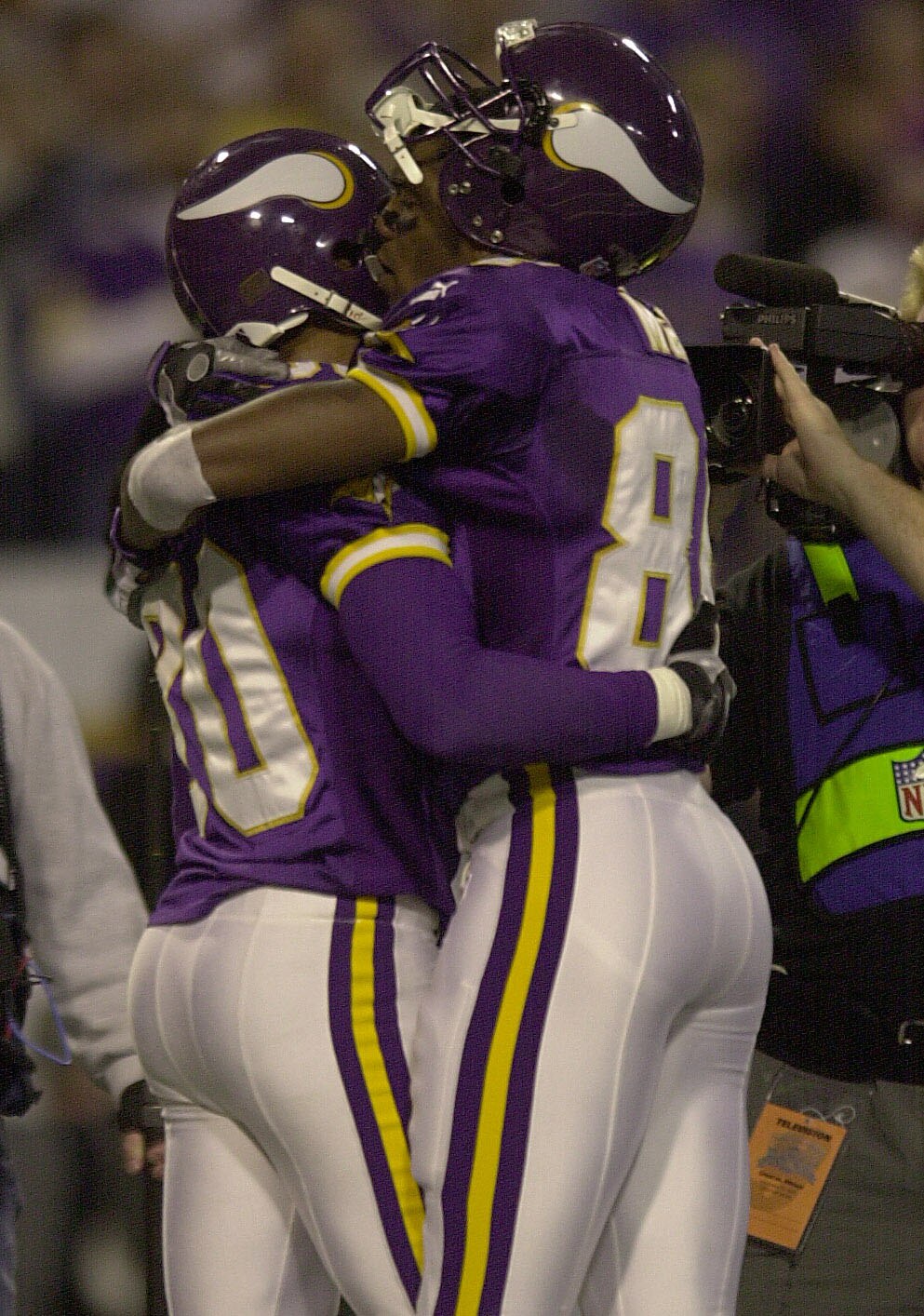 30 Nov 2000:  Cris Carter #80 of the Minnesota Vikings is congratulated by teammate Randy Moss #84 after Carter achieved the 1,000 career receptions mark during the second quarter at the Hubert H. Humphrey Metrodome in Minneapolis, Minnesota.  DIGITAL. Ma