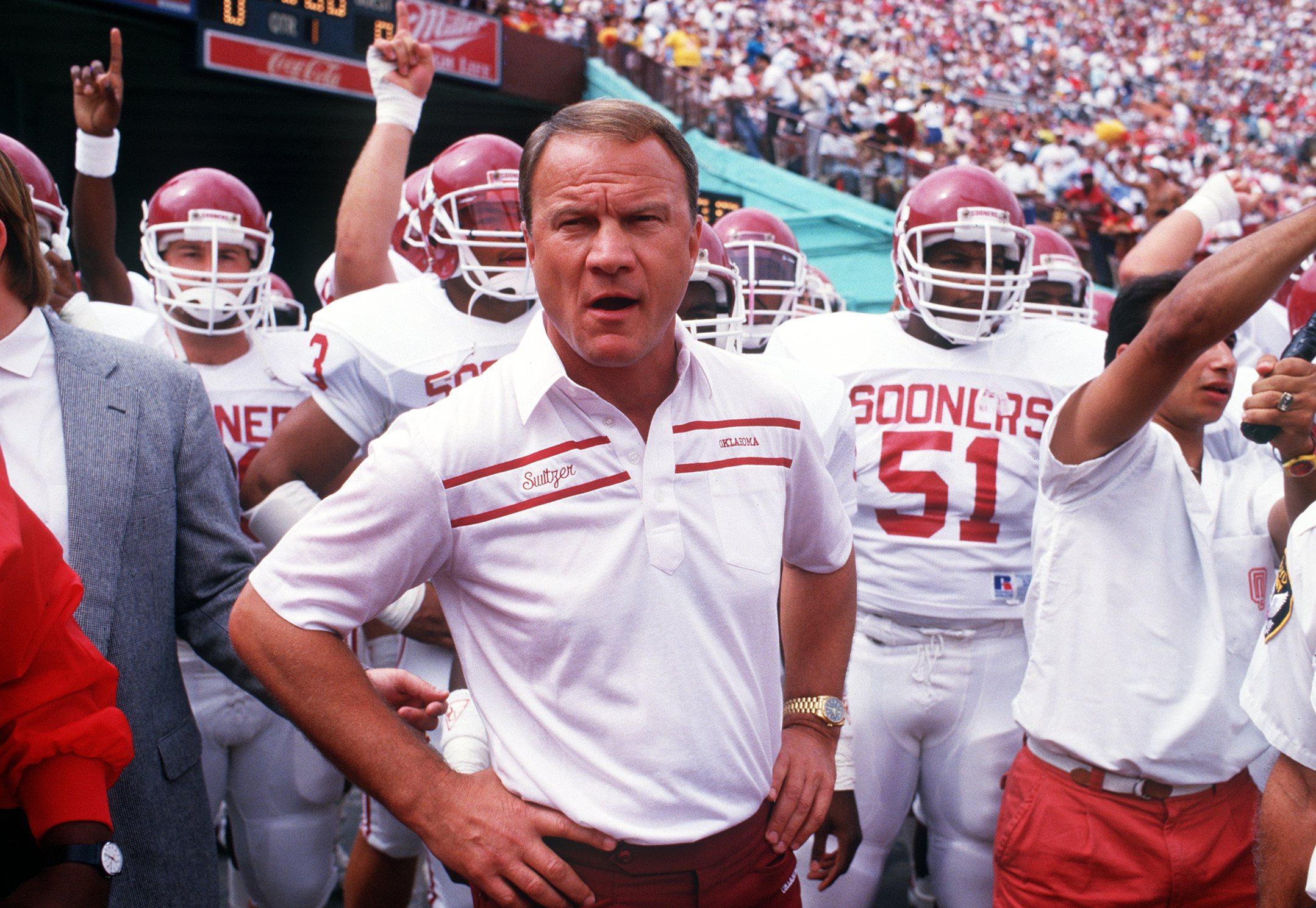 24 SEP 1988:  UNIVERSITY OF OKLAHOMA FOOTBALL COACH BARRY SWITZER LEADS HIS TEAM ON THE FIELD BEFORE THE SOONERS 23-7 LOSS TO THE USC TROJANS.  Mandatory Credit: Stephen Dunn/ALLSPORT