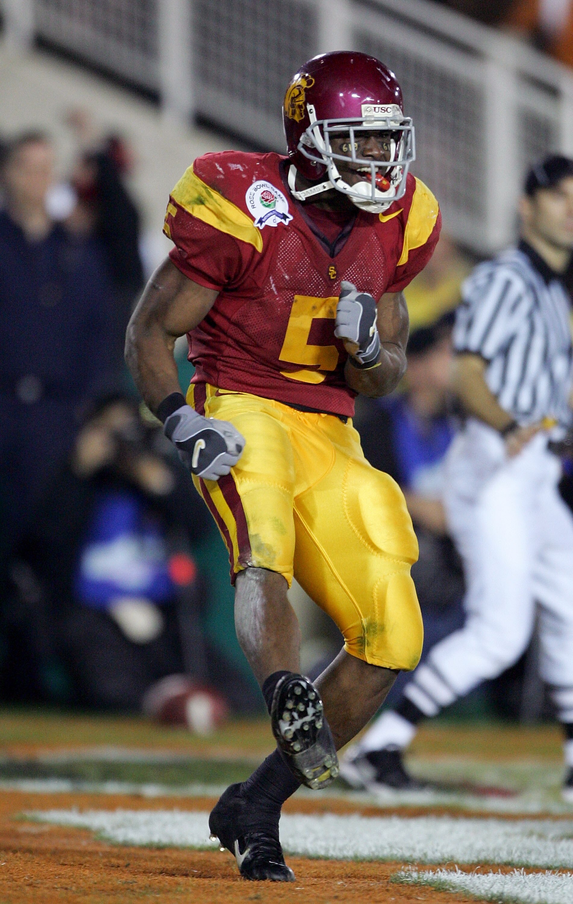 PASADENA, CA - JANUARY 04:  Reggie Bush #5 of the USC Trojans celebrates in the end zone after scoring a 26 yard touchdown in the fourth quarter of the BCS National Championship Rose Bowl Game against the Texas Longhorns at the Rose Bowl on January 4, 200