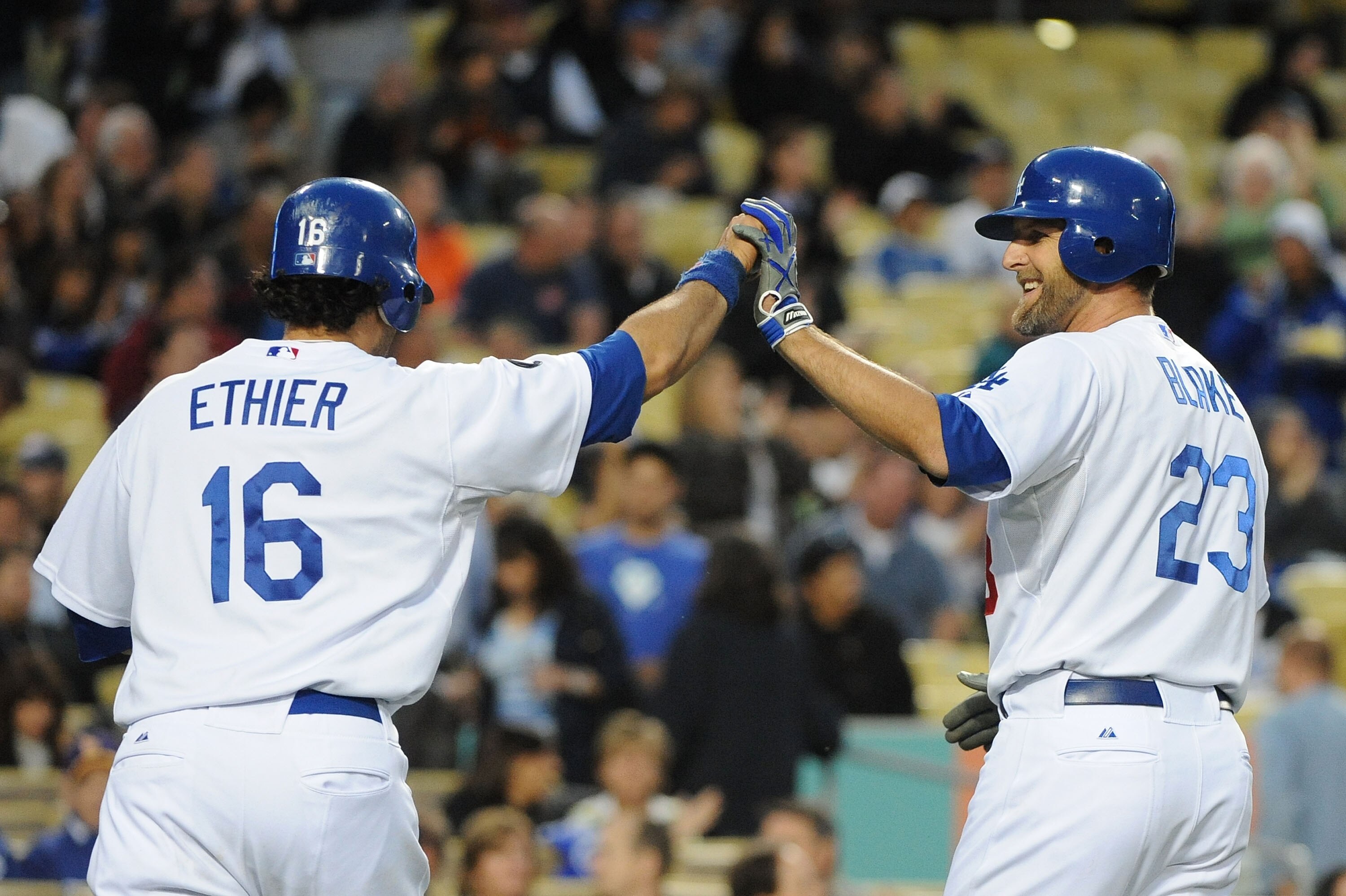 LOS ANGELES, CA - APRIL 20:  (L-R) Andre Ethier #16 celebrates with teammate Casey Blake #23 of the Los Angeles Dodgers after hitting a two run homerun in the first inning against the Atlanta Braves at Dodger Stadium on April 20, 2011 in Los Angeles, Cali