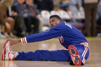 LOS ANGELES - 1990:  Dennis Hopson #2 of the New Jersey Nets stretches before the NBA game against the Los Angeles Lakers at the Great Western Forum in Los Angeles, California in 1990. NOTE TO USER: User expressly acknowledges and agrees that, by download