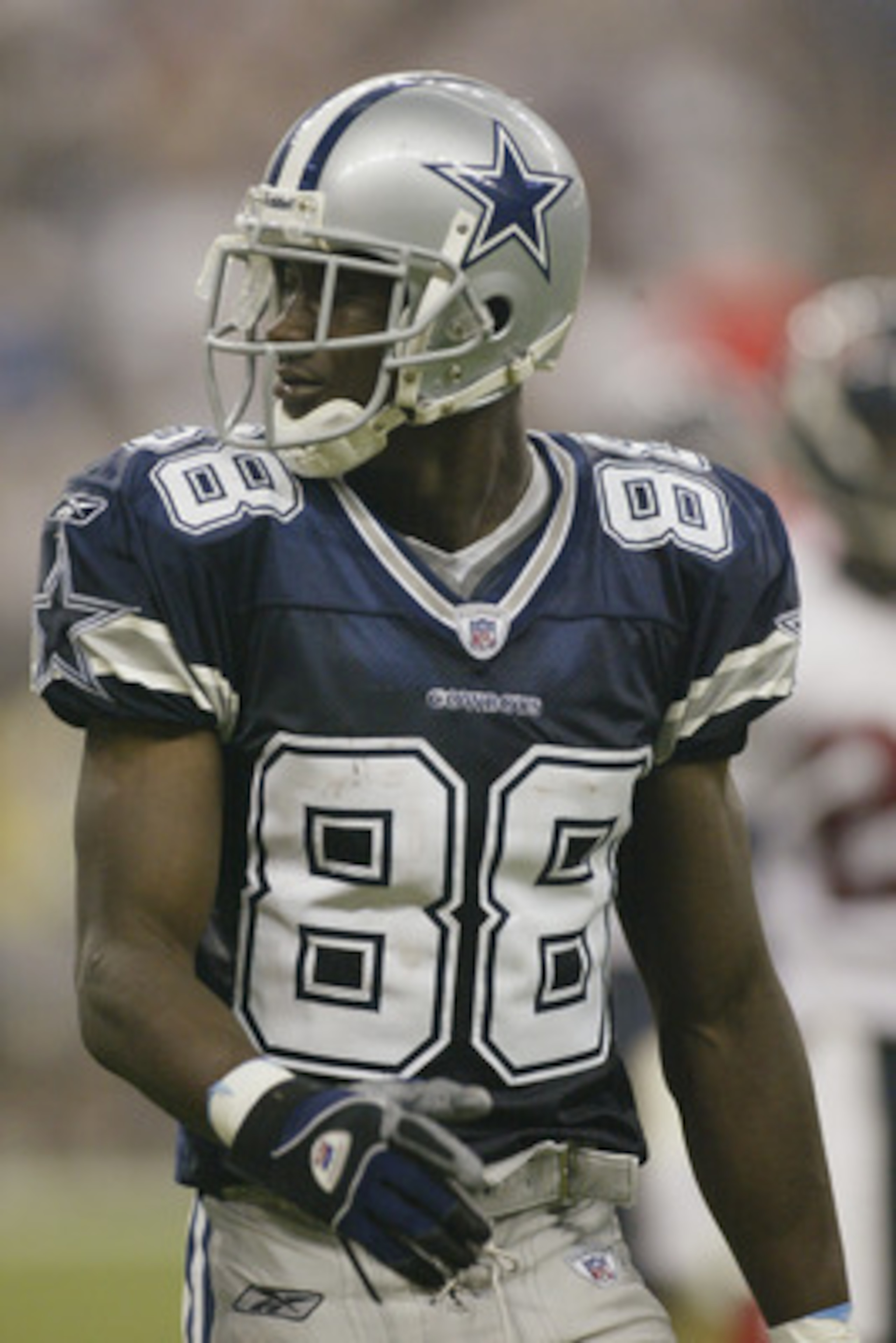 HOUSTON, TX - SEPTEMBER 8:  Wide receiver Antonio Bryant #88 of the Dallas Cowboys walks off the field during NFL game against the Houston Texans on September 8, 2002 at Reliant Stadium in Houston, Texas. The Texans won their first regular season game 19-