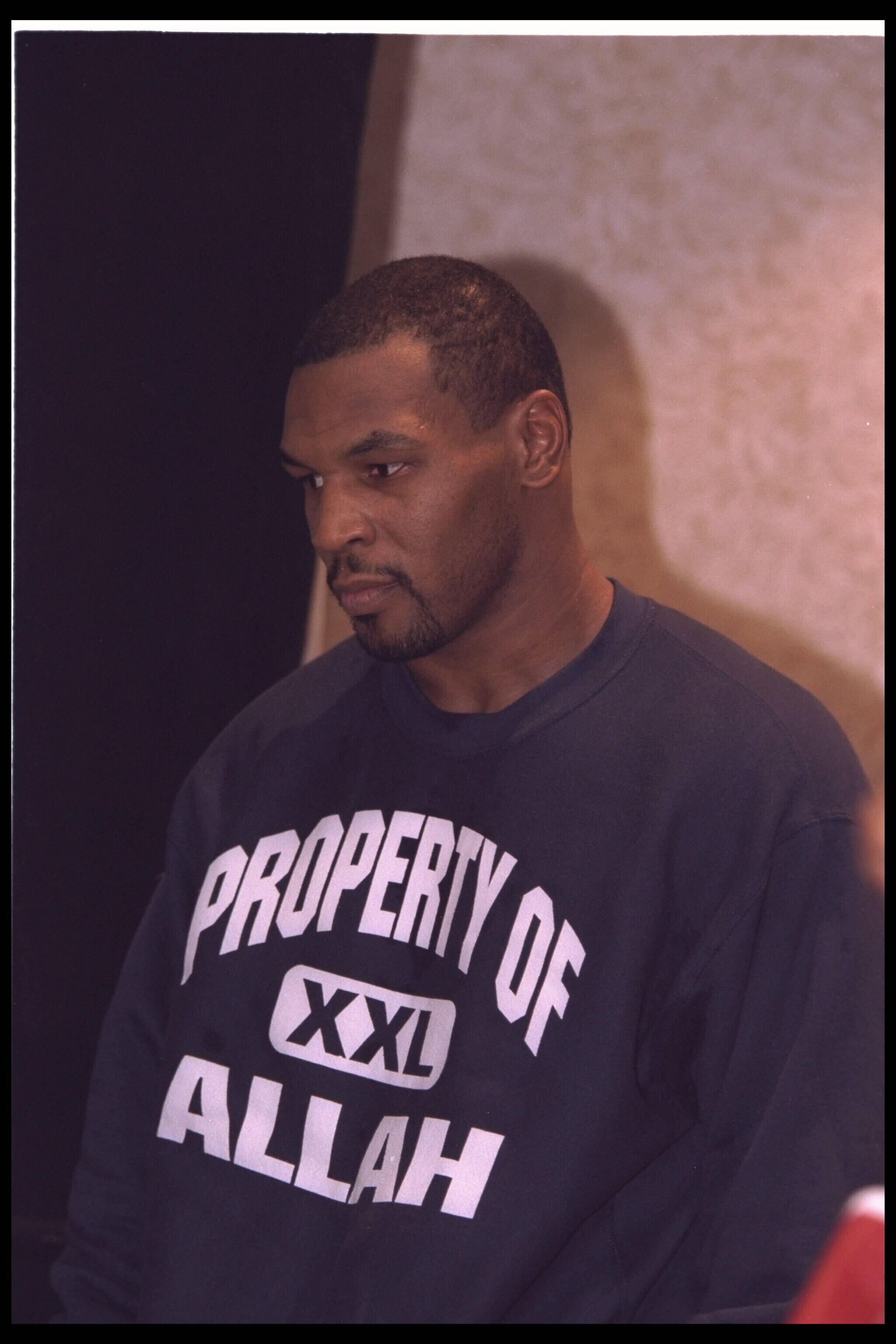 14 Dec 1995:  Boxer Mike Tyson who has converted to Islam waits to be weighed for his fight with Buster Mathis Jr.  Tyson knocked Mathis out in the third round in his second fight since being released from prison.   Mandatory Credit:  Simon Bruty/Allsport