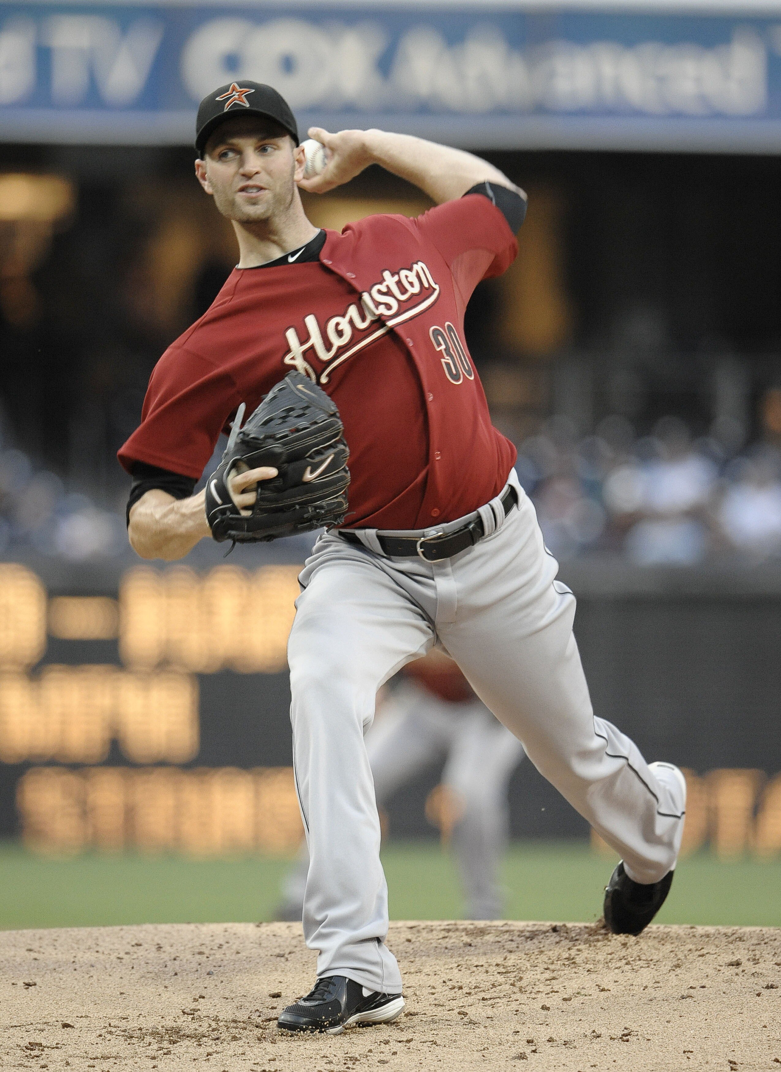 SAN DIEGO, CA-JUNE 3: J.A. Happ #30 of the Houston Astros pitches during the first inning of a baseball game against the San Diego Padres at Petco Park on June 3, 2011 in San Diego, California.  (Photo by Denis Poroy/Getty Images)
