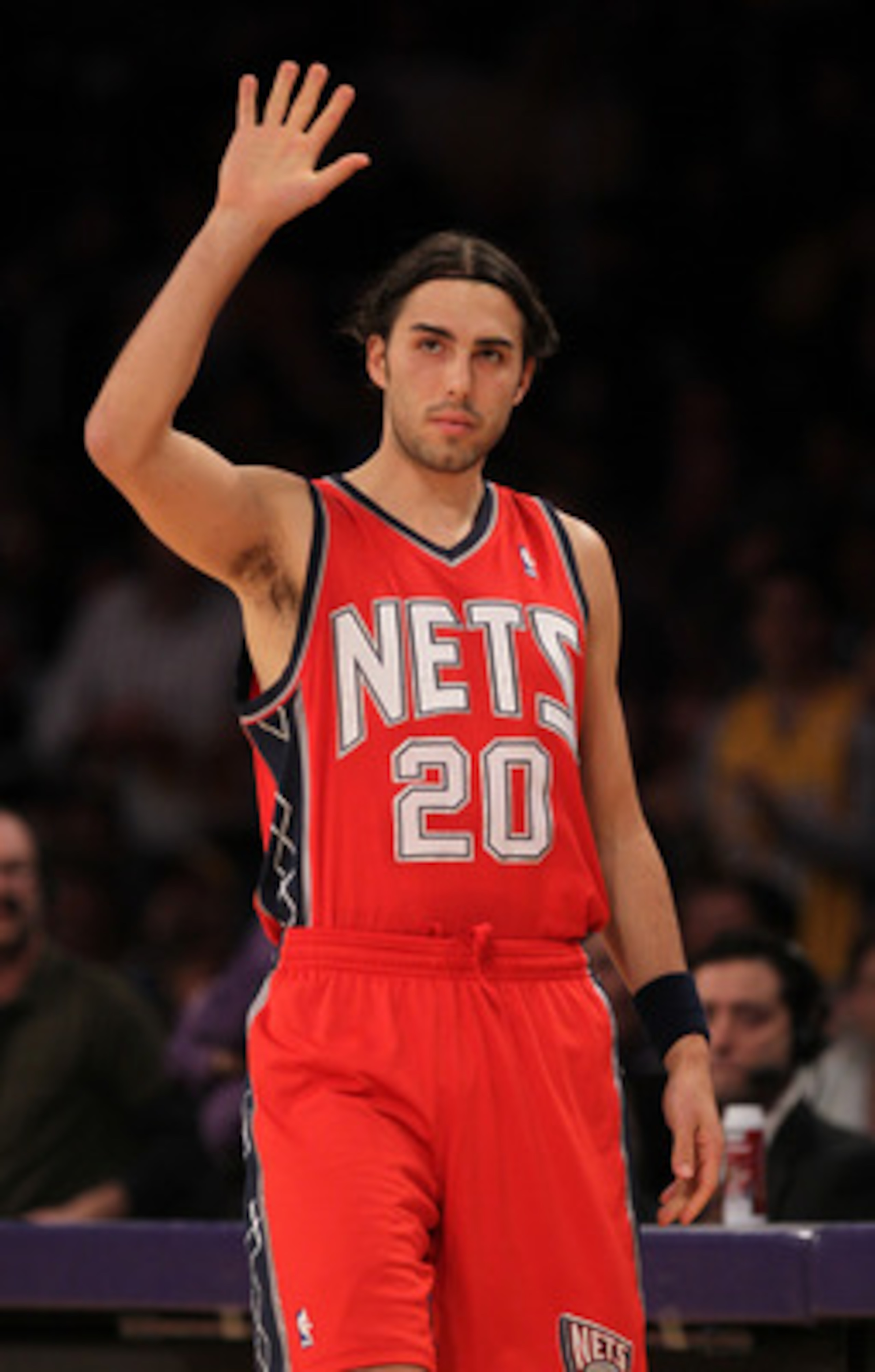 LOS ANGELES, CA - JANUARY 14: Sasha Vujacic #20 of the New Jersey Nets waves to the crowd as he enters the game in his first return since being traded by the Los Angeles Lakers at Staples Center on January 14, 2011 in Los Angeles, California. NOTE TO US LOS ANGELES, CA - JANUARY 14: Sasha Vujacic #20 of the New Jersey Nets waves to the crowd as he enters the game in his first return since being traded by the Los Angeles Lakers at Staples Center on January 14, 2011 in Los Angeles, California. NOTE TO US