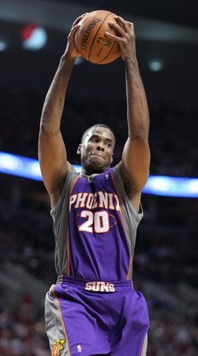 PORTLAND, OR - APRIL 29:  Jarron Collins #20 of the Phoenix Suns rebounds against the Portland Trail Blazers during Game Six of the Western Conference Quarterfinals of the NBA Playoffs on April 29, 2010 at the Rose Garden in Portland, Oregon. The Suns def