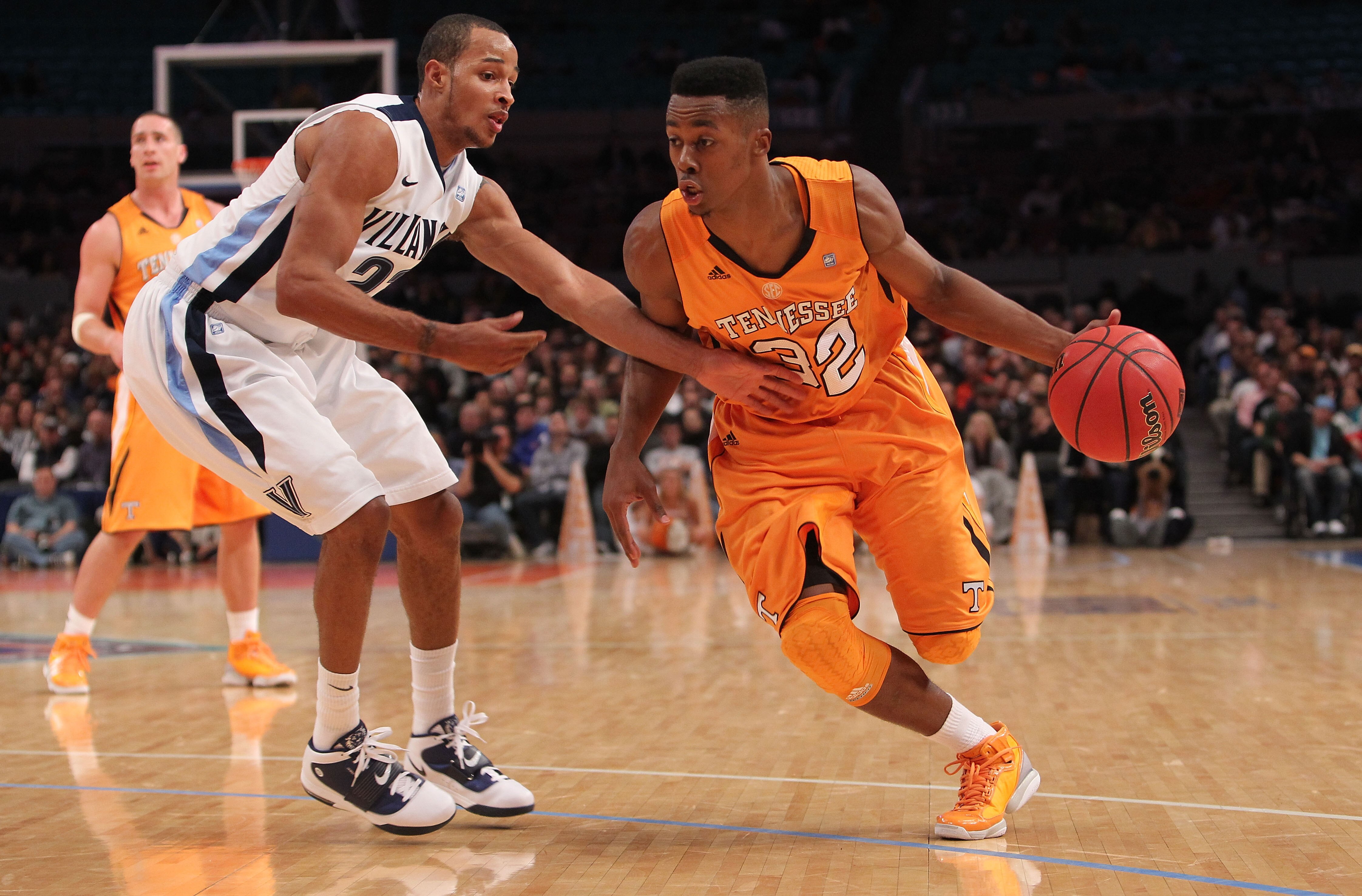 NEW YORK - NOVEMBER 26: Scotty Hopson #32 of the Tennessee Volunteers drives to the basket against Dominic Cheek #23 of the Villanova Wildcats  during the Championship game at Madison Square Garden on November 26, 2010 in New York City.  (Photo by Nick La