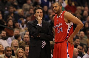 DALLAS, TX - JANUARY 25:  Head coach Vinny Del Negro and Brian Cook #34 of the Los Angeles Clippers at American Airlines Center on January 25, 2011 in Dallas, Texas.  NOTE TO USER: User expressly acknowledges and agrees that, by downloading and or using t