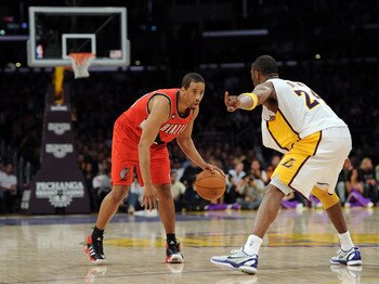 LOS ANGELES, CA - MARCH 20:  Andre Miller #24 of the Portland Trail Blazers faces off against Kobe Bryant #24 of the Los Angeles Lakers at the Staples Center on March 20, 2011 in Los Angeles, California.  NOTE TO USER: User expressly acknowledges and agre