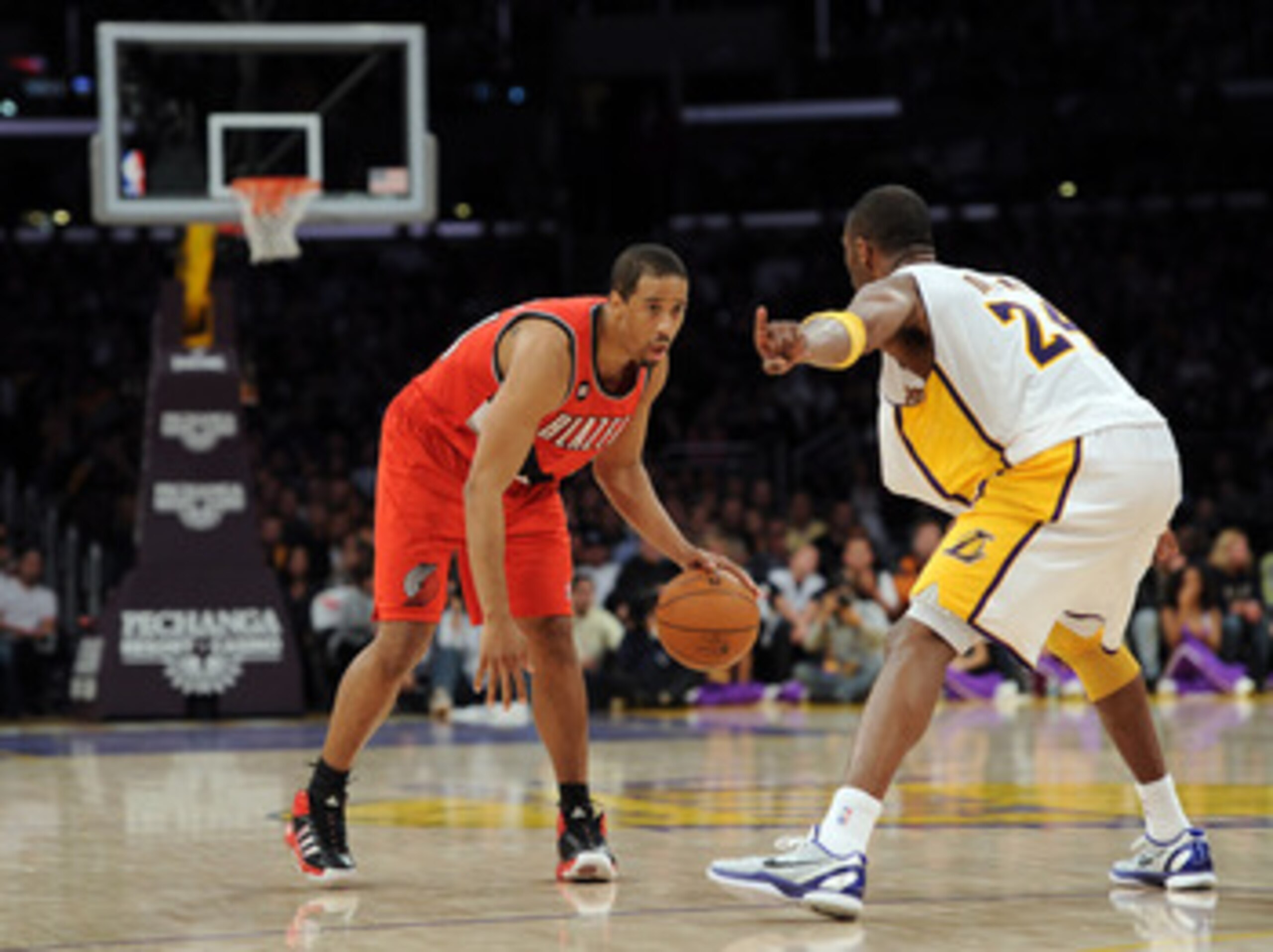 LOS ANGELES, CA - MARCH 20:  Andre Miller #24 of the Portland Trail Blazers faces off against Kobe Bryant #24 of the Los Angeles Lakers at the Staples Center on March 20, 2011 in Los Angeles, California.  NOTE TO USER: User expressly acknowledges and agre