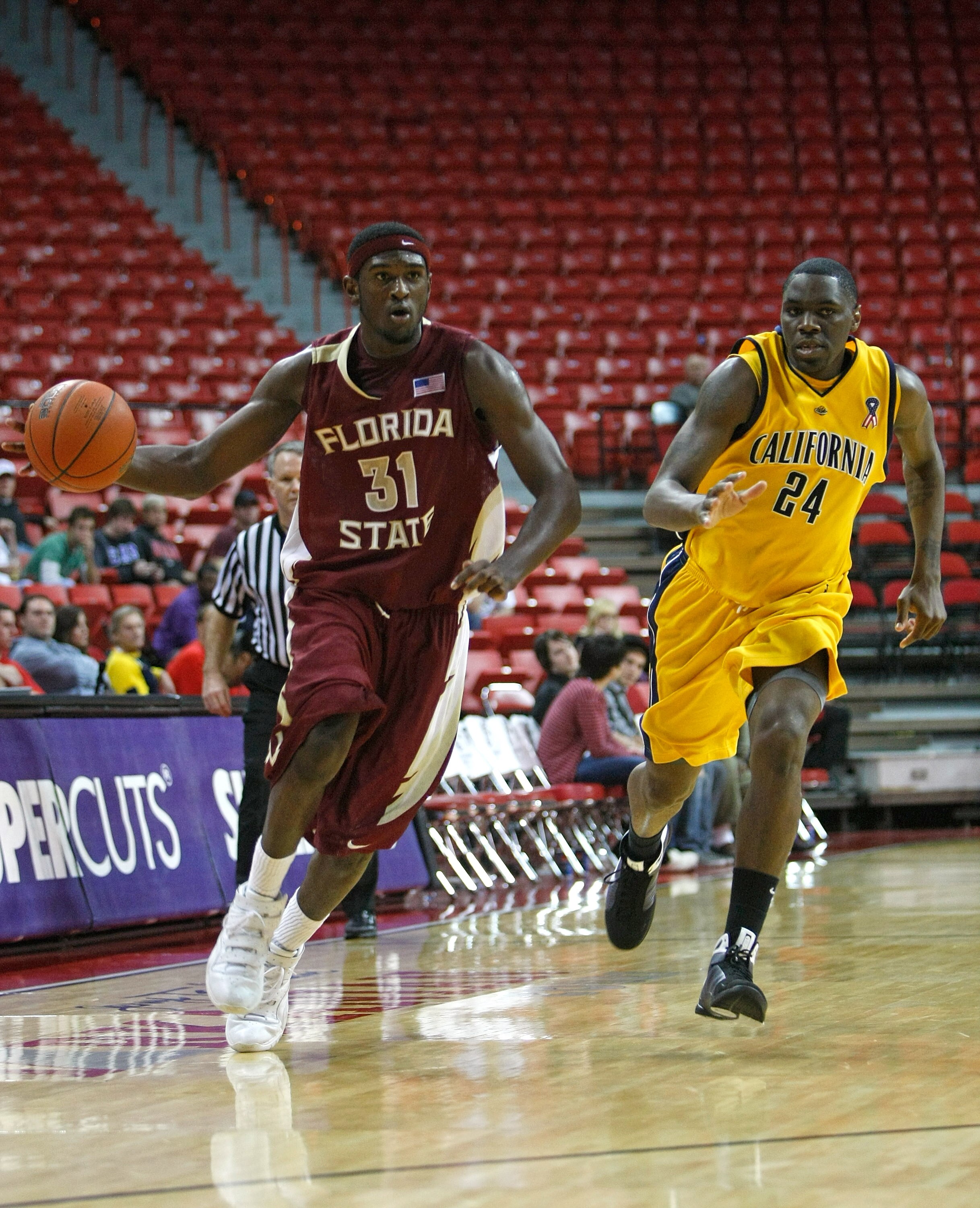 LAS VEGAS - NOVEMBER 29:  Chris Singleton #31 of Florida State drives against Theo Robertson #24 of California during the Global Sports Classic tournament championship game at the Thomas & Mack Center November 29, 2008 in Las Vegas, Nevada. Florida State