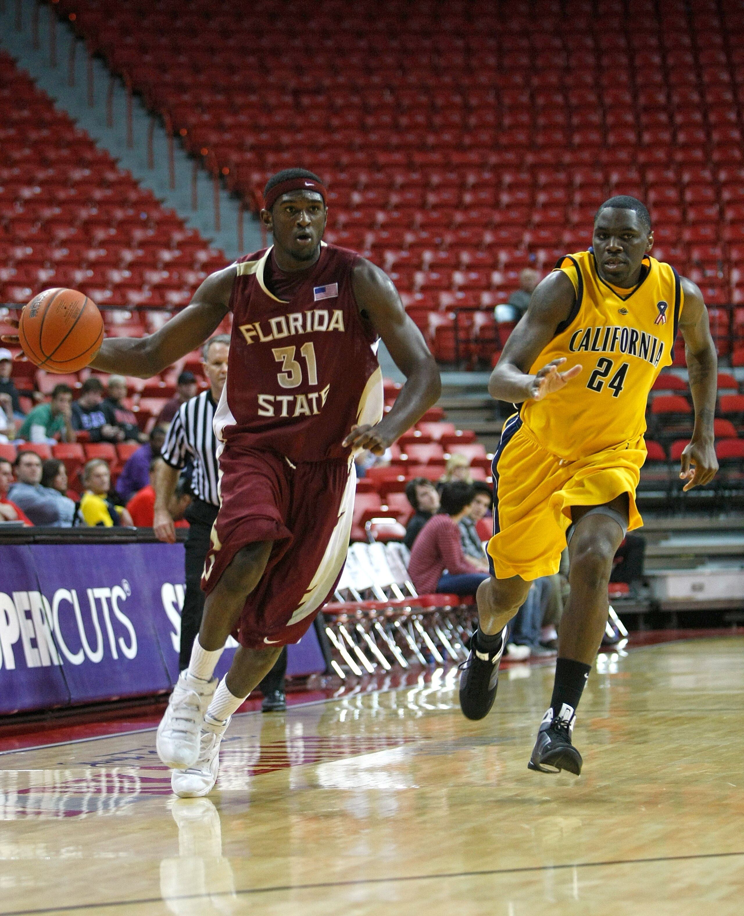 LAS VEGAS - NOVEMBER 29:  Chris Singleton #31 of Florida State drives against Theo Robertson #24 of California during the Global Sports Classic tournament championship game at the Thomas & Mack Center November 29, 2008 in Las Vegas, Nevada. Florida State