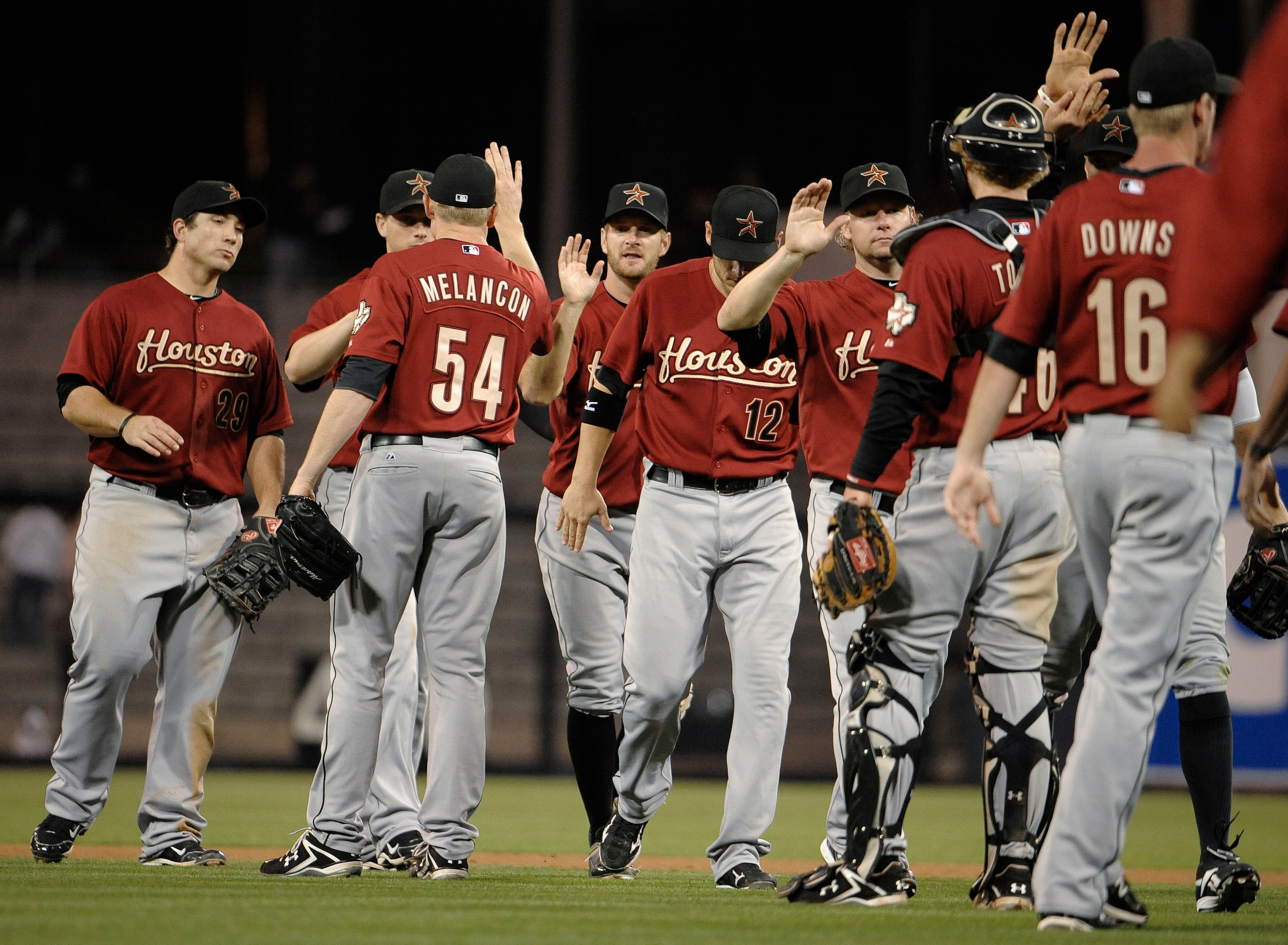 SAN DIEGO, CA-JUNE 2:Houston Astros players high-five after beating the San Diego Padres 7-4 in a baseball game at Petco Park on June 2, 2011 in San Diego, California.  (Photo by Denis Poroy/Getty Images)