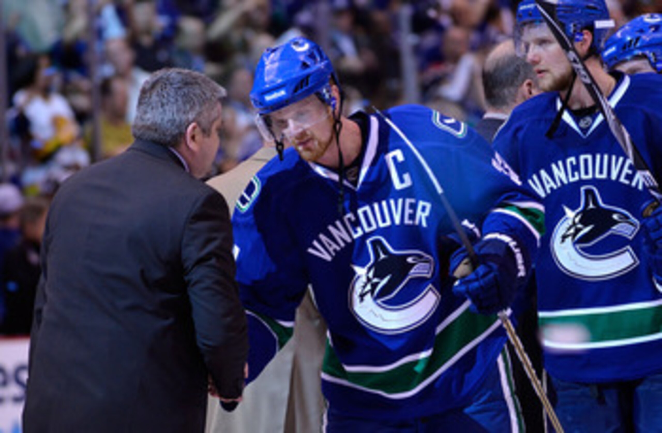 VANCOUVER, BC - MAY 24: Captain Henrik Sedin #33 of the Vancouver Canucks shakes hands with Head Coach Todd McLellan of the San Jose Sharks after the Vancouver Canucks won Game Five of the Western Conference Finals 3-2 in the second overtime to win the s VANCOUVER, BC - MAY 24: Captain Henrik Sedin #33 of the Vancouver Canucks shakes hands with Head Coach Todd McLellan of the San Jose Sharks after the Vancouver Canucks won Game Five of the Western Conference Finals 3-2 in the second overtime to win the s