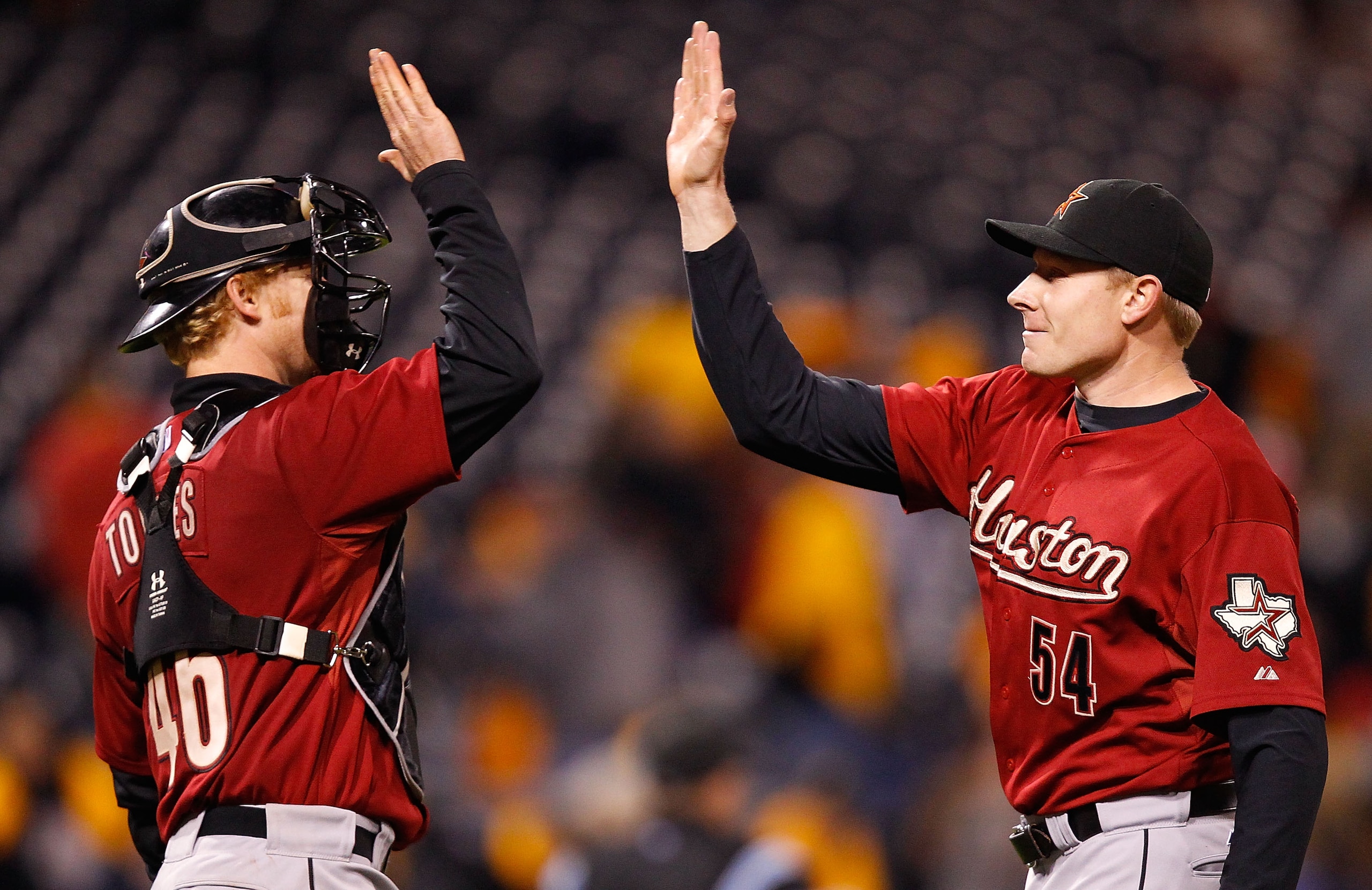 PITTSBURGH - MAY 06: Mark Melancon #54 of the Houston Astros celebrates with teammate J.R. Towles #46 after beating the Pittsburgh Pirates 4-3 on May 6, 2011 at PNC Park in Pittsburgh, Pennsylvania.  (Photo by Jared Wickerham/Getty Images)