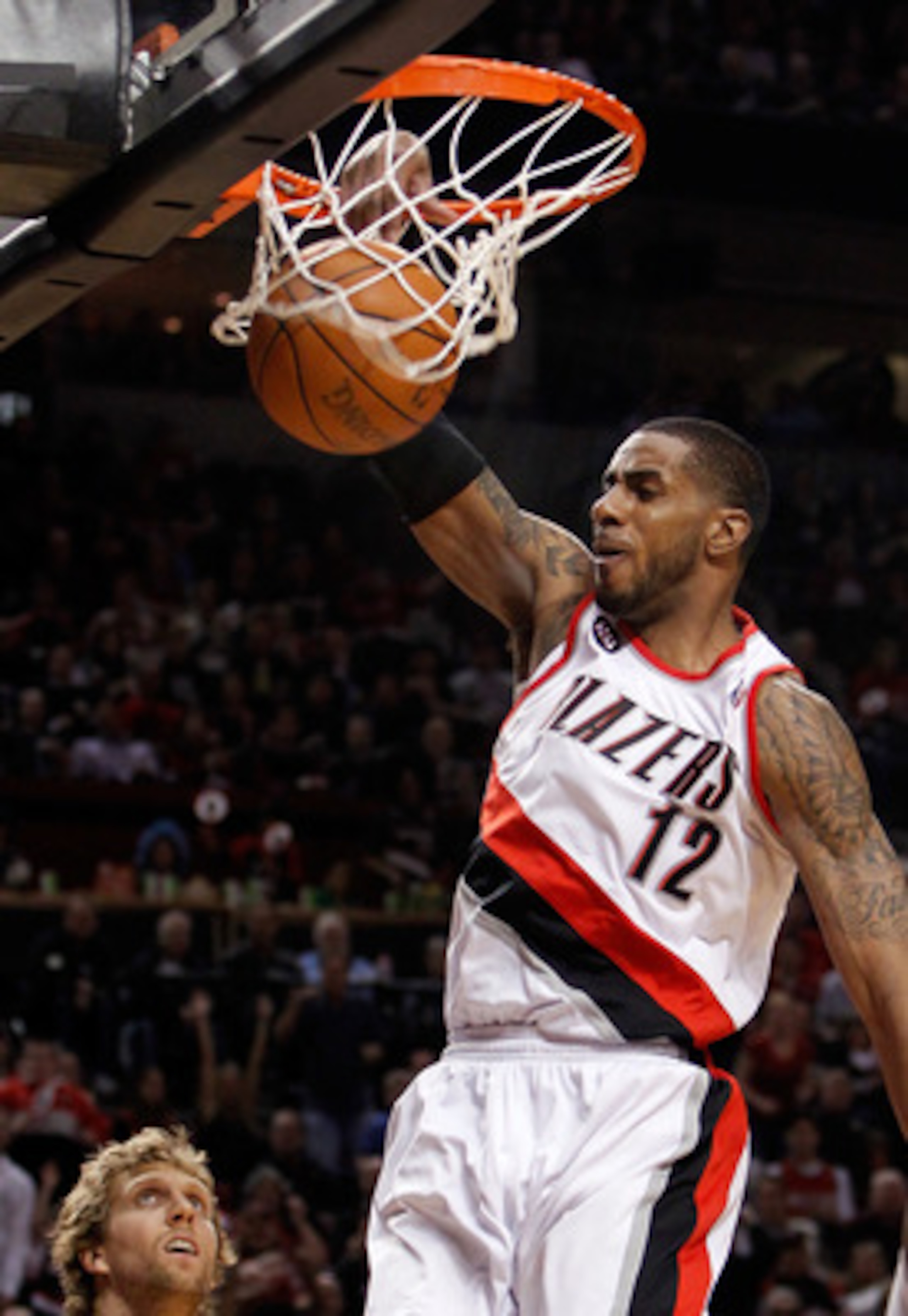 PORTLAND, OR - APRIL 21:  LaMarcus Aldridge #12 of the Portland Trail Blazers dunks against the Dallas Mavericks in Game Three of the Western Conference Quarterfinals in the 2011 NBA Playoffs on April 21, 2011 at the Rose Garden in Portland, Oregon. NOTE 