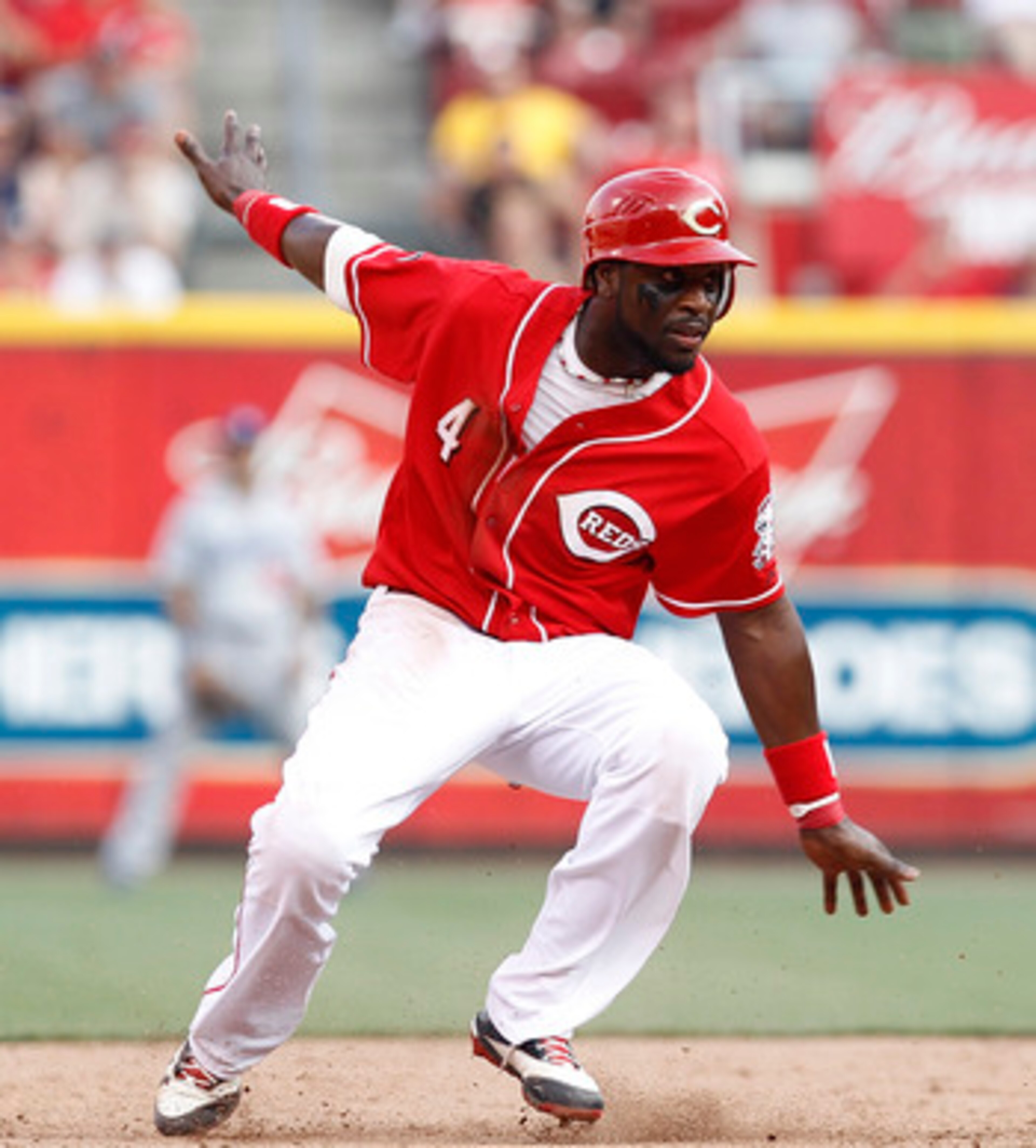 CINCINNATI, OH - JUNE 4: Brandon Phillips #4 of the Cincinnati Reds tries to keep his balance after rounding second base against the Los Angeles Dodgers at Great American Ball Park on June 4, 2011 in Cincinnati, Ohio. The Dodgers won 11-8 in eleven inning