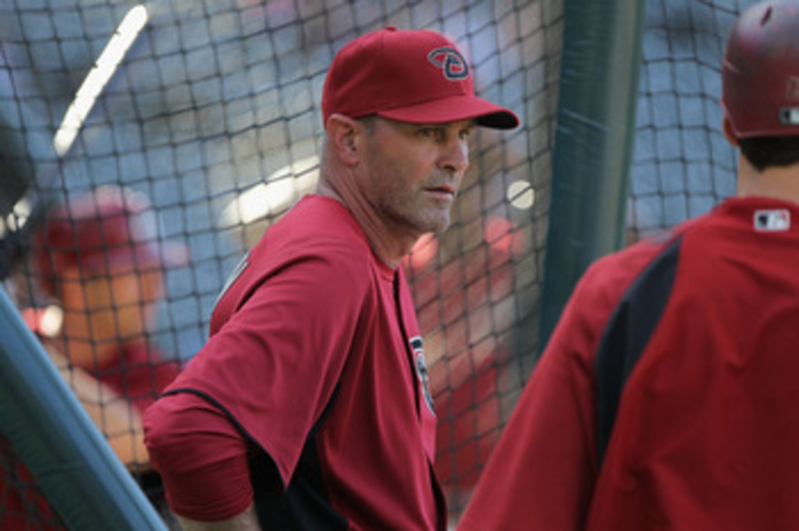 DENVER, CO - APRIL 02:  Manager Kirk Gibson #23 of the Arizona Diamondbacks watches his team as they take batting practice prior to facing the Colorado Rockies at Coors Field on April 2, 2011 in Denver, Colorado. The Rockies defeated the Diamondbacks 3-1.