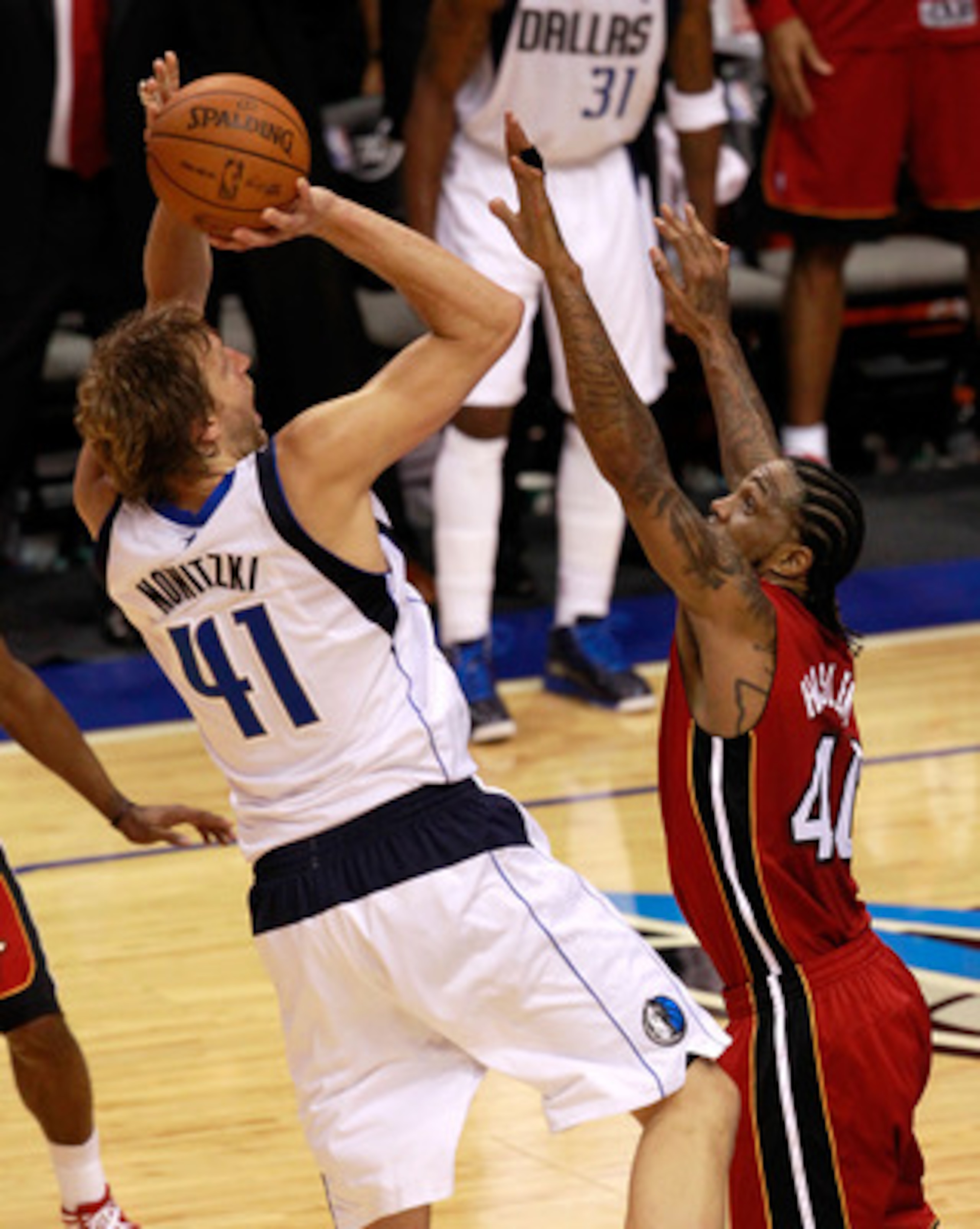 DALLAS, TX - JUNE 05:  Dirk Nowitzki #41 of the Dallas Mavericks misses a last-second shot attempt over Udonis Haslem #40 of the Miami Heat as the Mavericks were defeated 88-86 in Game Three of the 2011 NBA Finals at American Airlines Center on June 5, 20