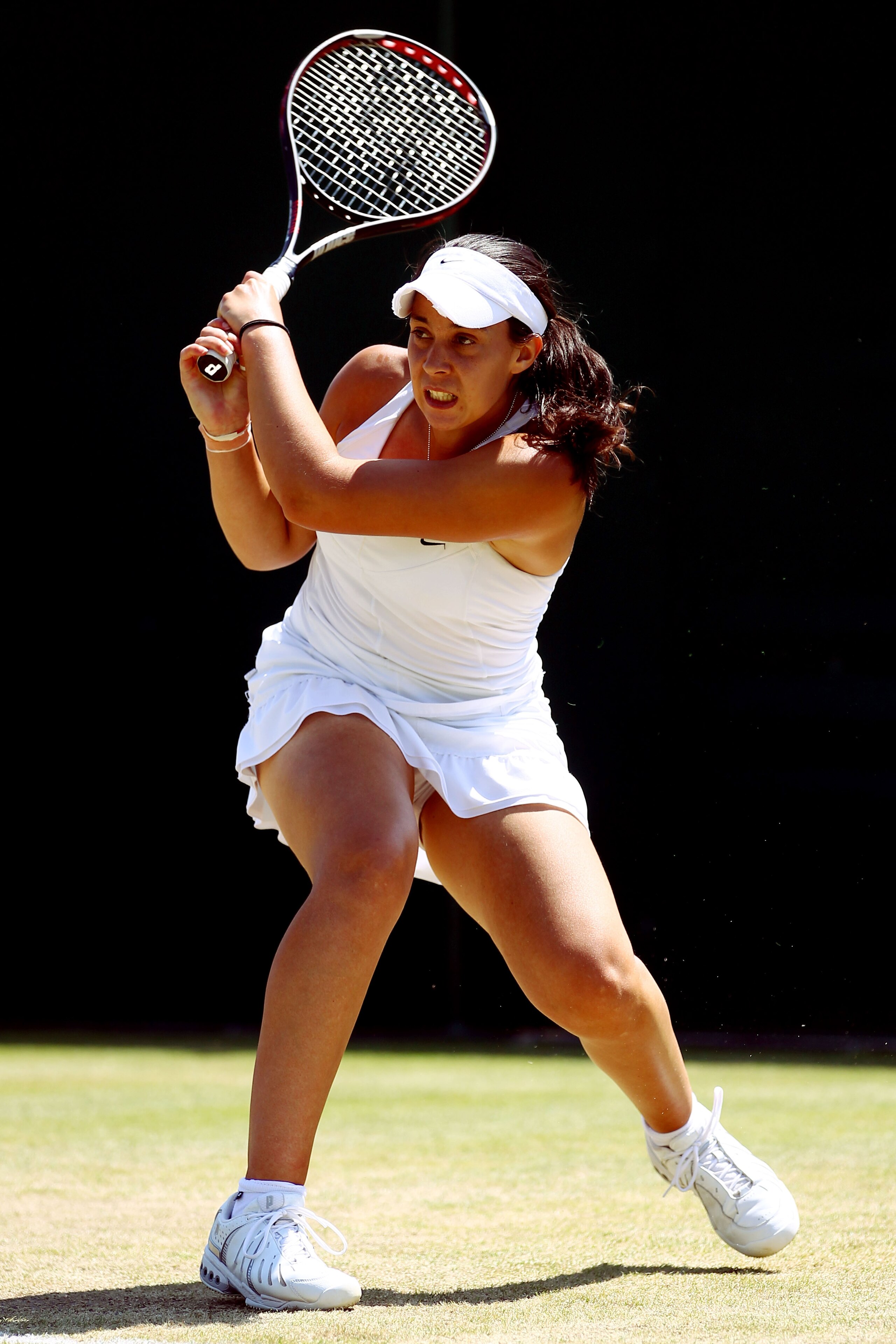 LONDON, ENGLAND - JUNE 28:  Marion Bartoli of France in action against Tsvetana Pironkova of Bularia on Day Seven of the Wimbledon Lawn Tennis Championships at the All England Lawn Tennis and Croquet Club on June 28, 2010 in London, England.  (Photo by Ju