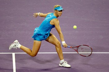 DOHA, QATAR - OCTOBER 28:  Elena Dementieva of Russia returns a shot to Samantha Stosur of Australia during day three of the WTA Championships at the Khalifa Tennis Complex on October 28, 2010 in Doha, Qatar.  (Photo by Matthew Stockman/Getty Images)