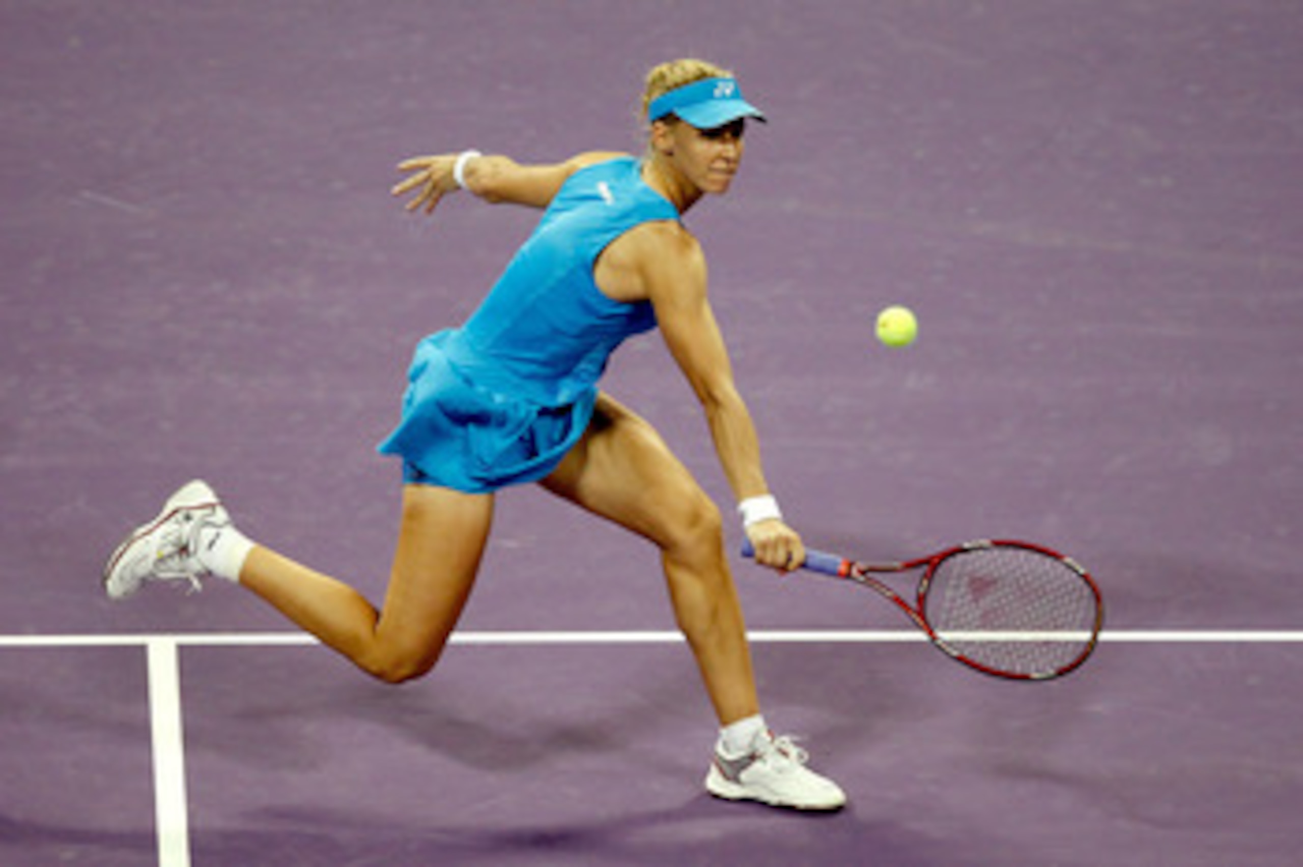 DOHA, QATAR - OCTOBER 28: Elena Dementieva of Russia returns a shot to Samantha Stosur of Australia during day three of the WTA Championships at the Khalifa Tennis Complex on October 28, 2010 in Doha, Qatar. (Photo by Matthew Stockman/Getty Images) DOHA, QATAR - OCTOBER 28: Elena Dementieva of Russia returns a shot to Samantha Stosur of Australia during day three of the WTA Championships at the Khalifa Tennis Complex on October 28, 2010 in Doha, Qatar. (Photo by Matthew Stockman/Getty Images)