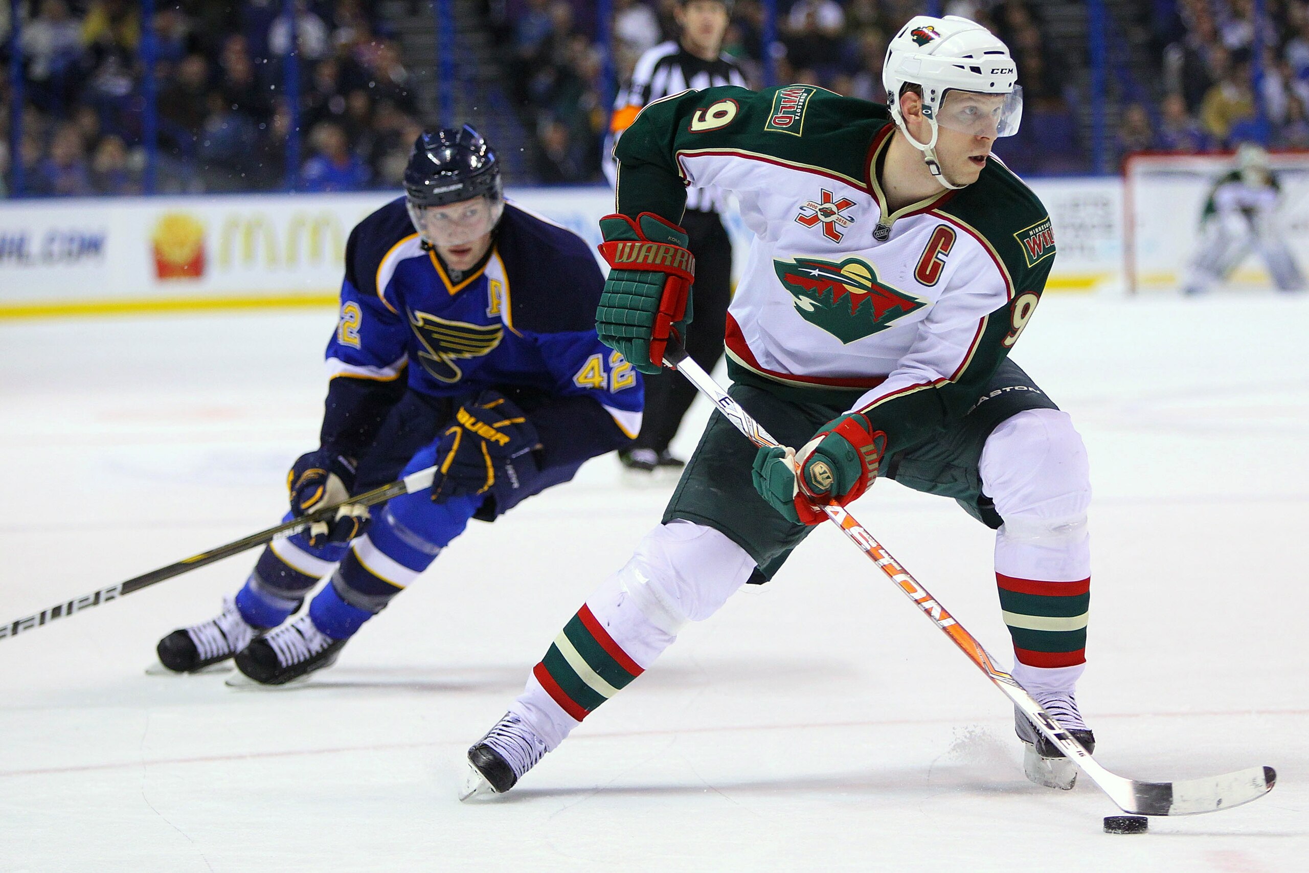 ST. LOUIS, MO - MARCH 29: Mikko Koivu #9 of the Minnesota Wild moves the puck up ice against the St. Louis Blues at the Scottrade Center on March 29, 2011 in St. Louis, Missouri.  (Photo by Dilip Vishwanat/Getty Images)