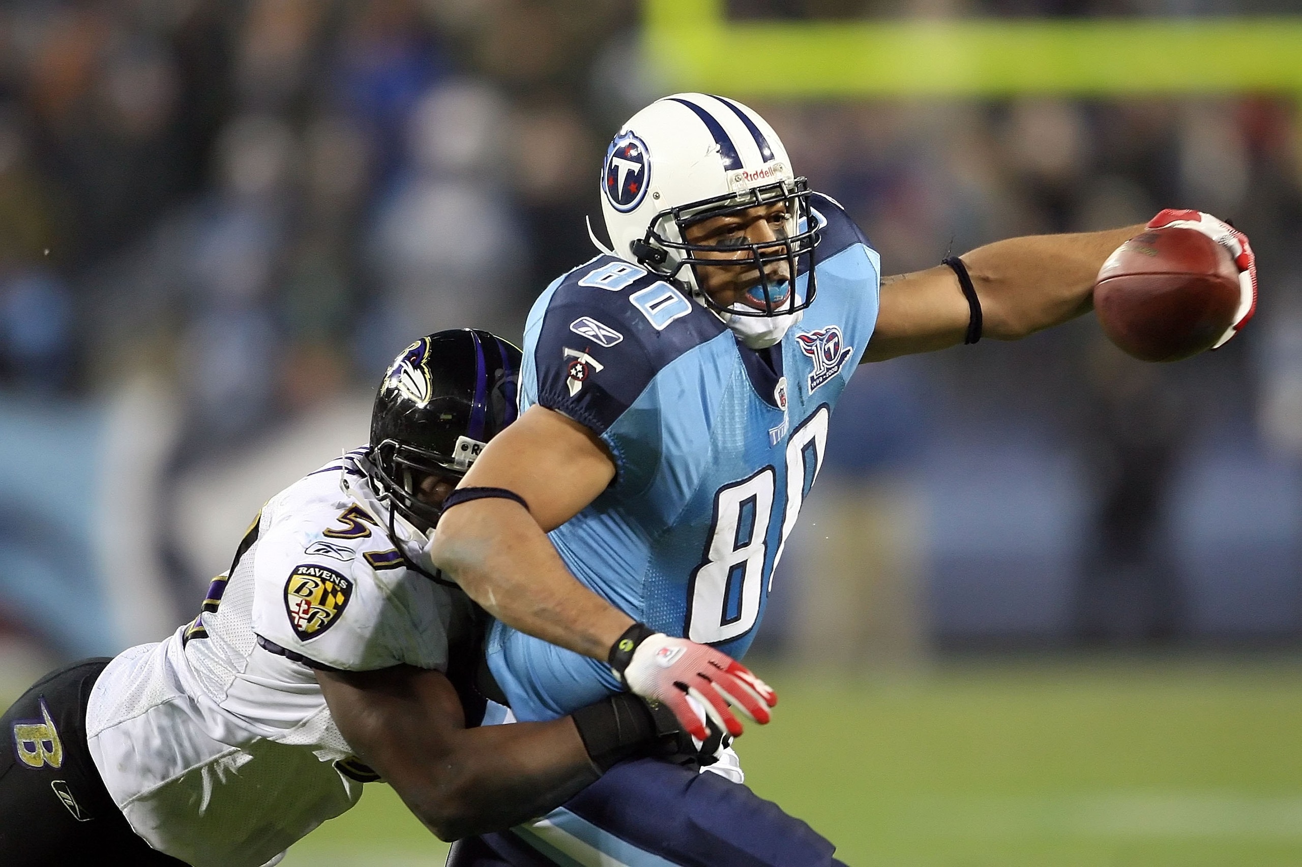 NASHVILLE, TN - JANUARY 10:  Tight end Bo Scaife #80 of the Tennessee Titans looks to avoid a tackle by linebacker Bart Scott #57 of the Baltimore Ravens during the AFC Divisional Playoff Game on January 10, 2009 at LP Field in Nashville, Tennessee.  (Pho