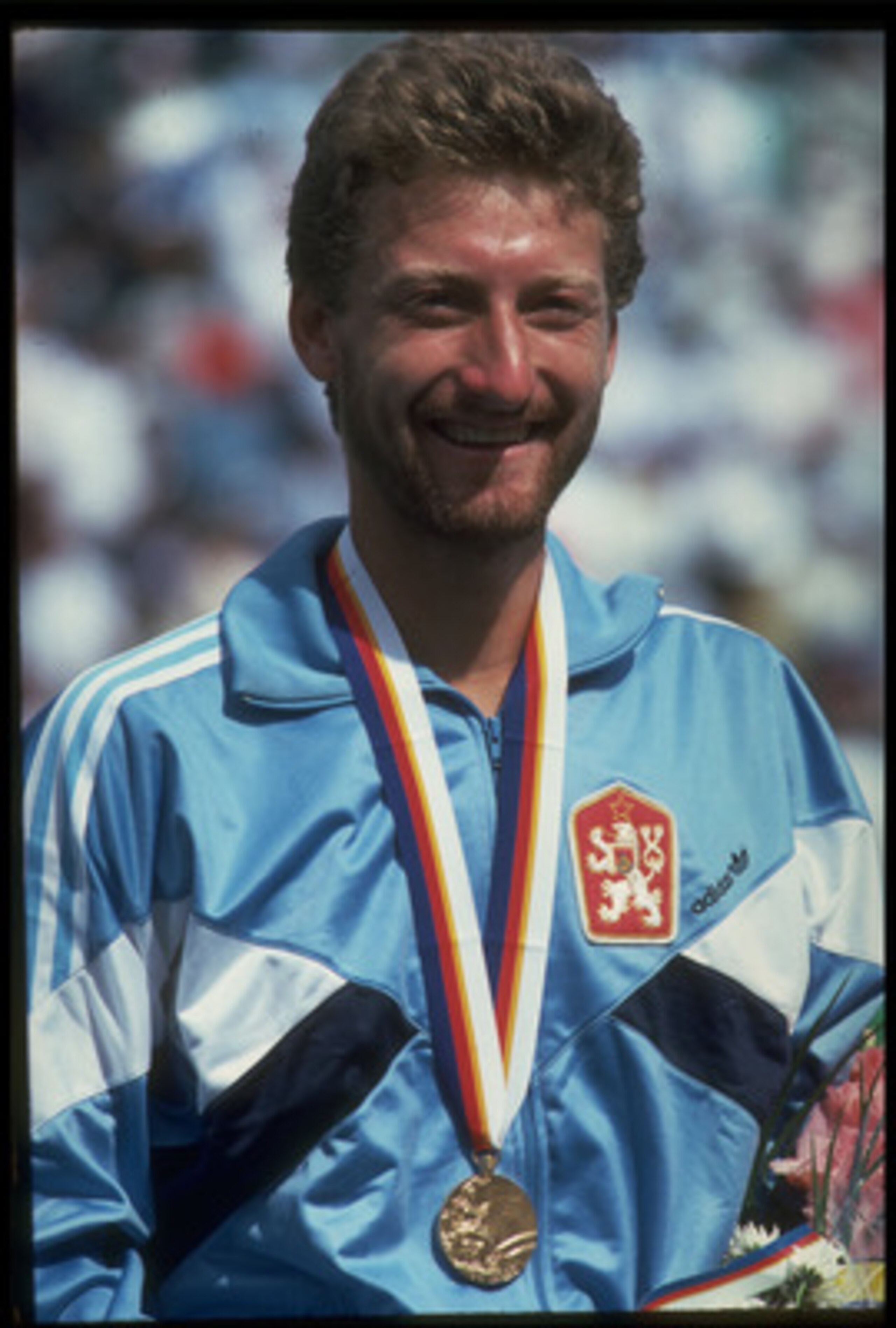 30 SEP 1988: MILOSLAV MECIR OF CZECHOSLOVAKIA SMILES AFTER RECEIVING HIS GOLD MEDAL FOR WINNING THE MENS SINGLE TENNIS TOURNAMENT AT THE 1988 SEOUL OLYMPICS. MECIR DEFEATED TIM MAYOTTE OF THE UNITED STATES 3-6, 6-2, 6-4 AND 6-2 TO CLAIM THE GOLD. 30 SEP 1988: MILOSLAV MECIR OF CZECHOSLOVAKIA SMILES AFTER RECEIVING HIS GOLD MEDAL FOR WINNING THE MENS SINGLE TENNIS TOURNAMENT AT THE 1988 SEOUL OLYMPICS. MECIR DEFEATED TIM MAYOTTE OF THE UNITED STATES 3-6, 6-2, 6-4 AND 6-2 TO CLAIM THE GOLD.
