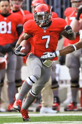 COLUMBUS, OH - NOVEMBER 27:  Jordan Hall #7 of the Ohio State Buckeyes returns a kickoff against the Michigan Wolverines at Ohio Stadium on November 27, 2010 in Columbus, Ohio.  (Photo by Jamie Sabau/Getty Images)