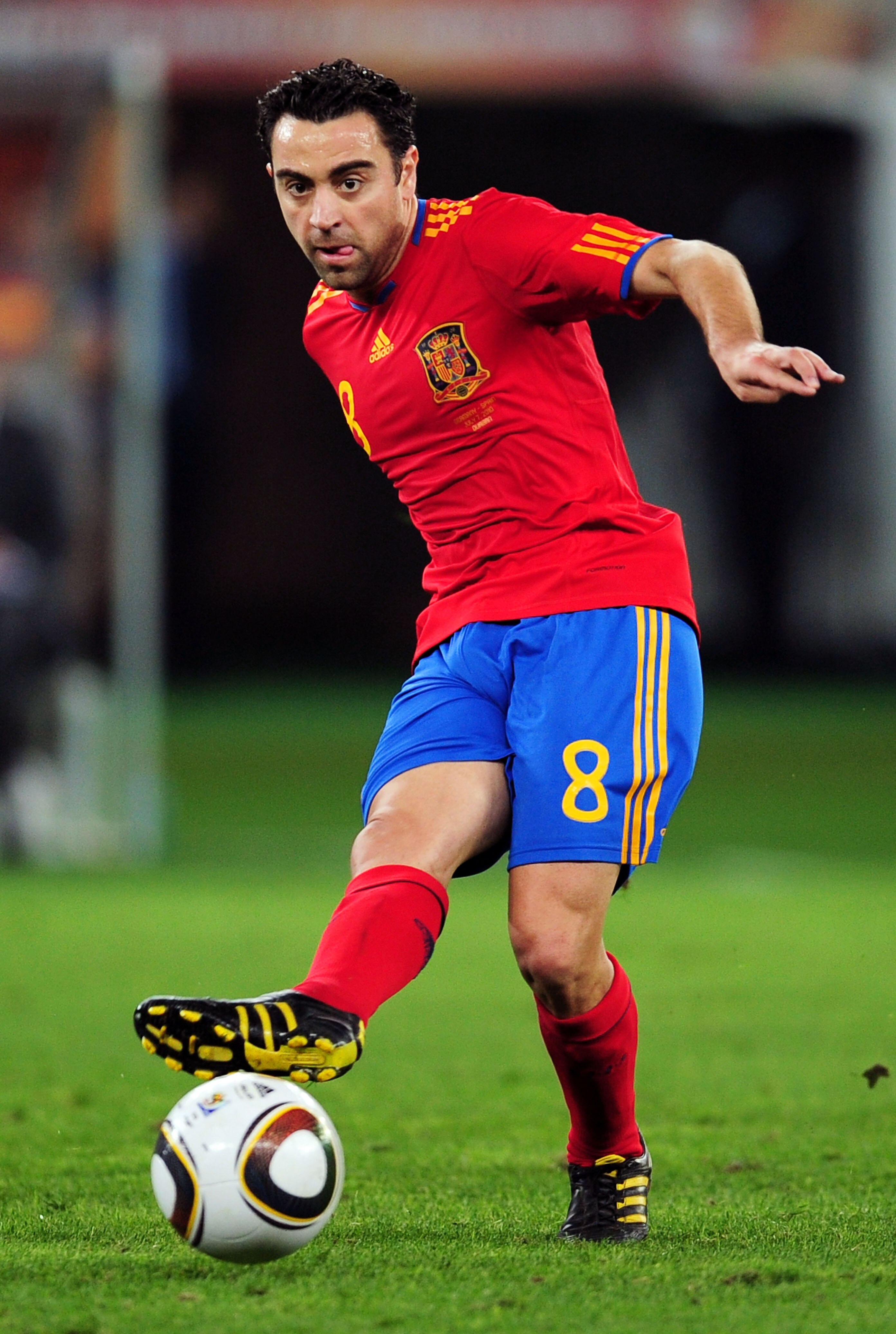 DURBAN, SOUTH AFRICA - JULY 07:  Xavi Hernandez of Spain passes the ball during the 2010 FIFA World Cup South Africa Semi Final match between Germany and Spain at Durban Stadium on July 7, 2010 in Durban, South Africa.  (Photo by Clive Mason/Getty Images)