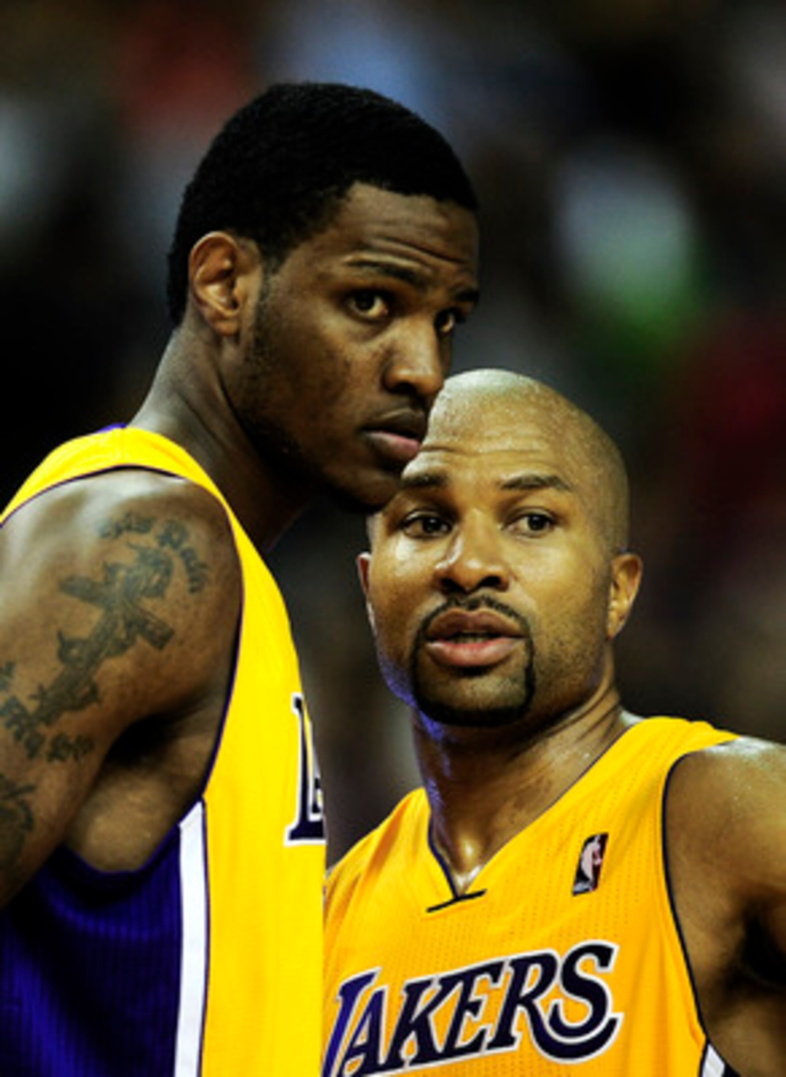 BARCELONA, SPAIN - OCTOBER 07:  Devin Ebanks #3 (L) of the Los Angeles Lakers and his teammate Derek Fisher #2 chat during the NBA Europe Live match between Los Angeles Lakers and Regal FC Barcelona at the at Palau Blaugrana on October 7, 2010 in Barcelon