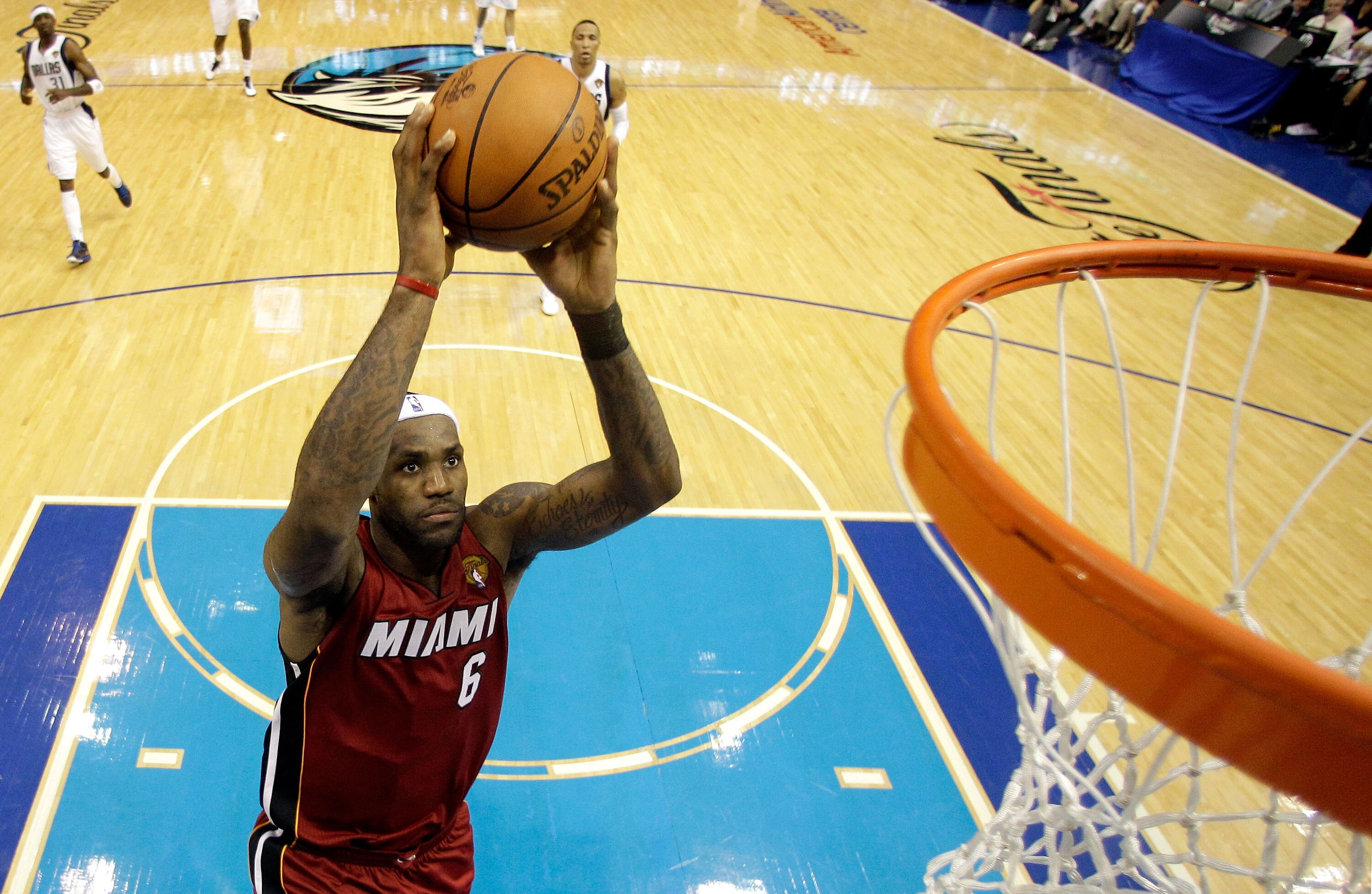 DALLAS, TX - JUNE 05:  LeBron James #6 of the Miami Heat dunks the ball on a breakaway in the second half while taking on the Dallas Mavericks in Game Three of the 2011 NBA Finals at American Airlines Center on June 5, 2011 in Dallas, Texas.  NOTE TO USER
