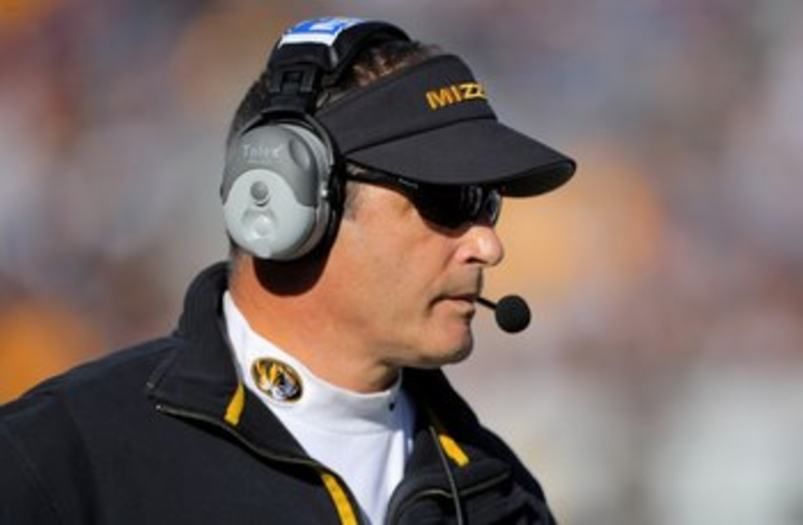 BOULDER, CO - OCTOBER 31:  Head coach Gary Pinkel of the Missouri Tigers leads his team against the Colorado Buffaloes at Folsom Field on October 31, 2009 in Boulder, Colorado. Missouri defeated Colorado 36-17.  (Photo by Doug Pensinger/Getty Images)