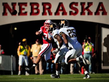 LINCOLN, NE - OCTOBER 30: Quarterback Taylor Martinez #3 of the Nebraska Cornhuskers throws over the Missouri Tigers defense during first half action of their game at Memorial Stadium on October 30, 2010 in Lincoln, Nebraska. Nebraska Defeated Missouri 31