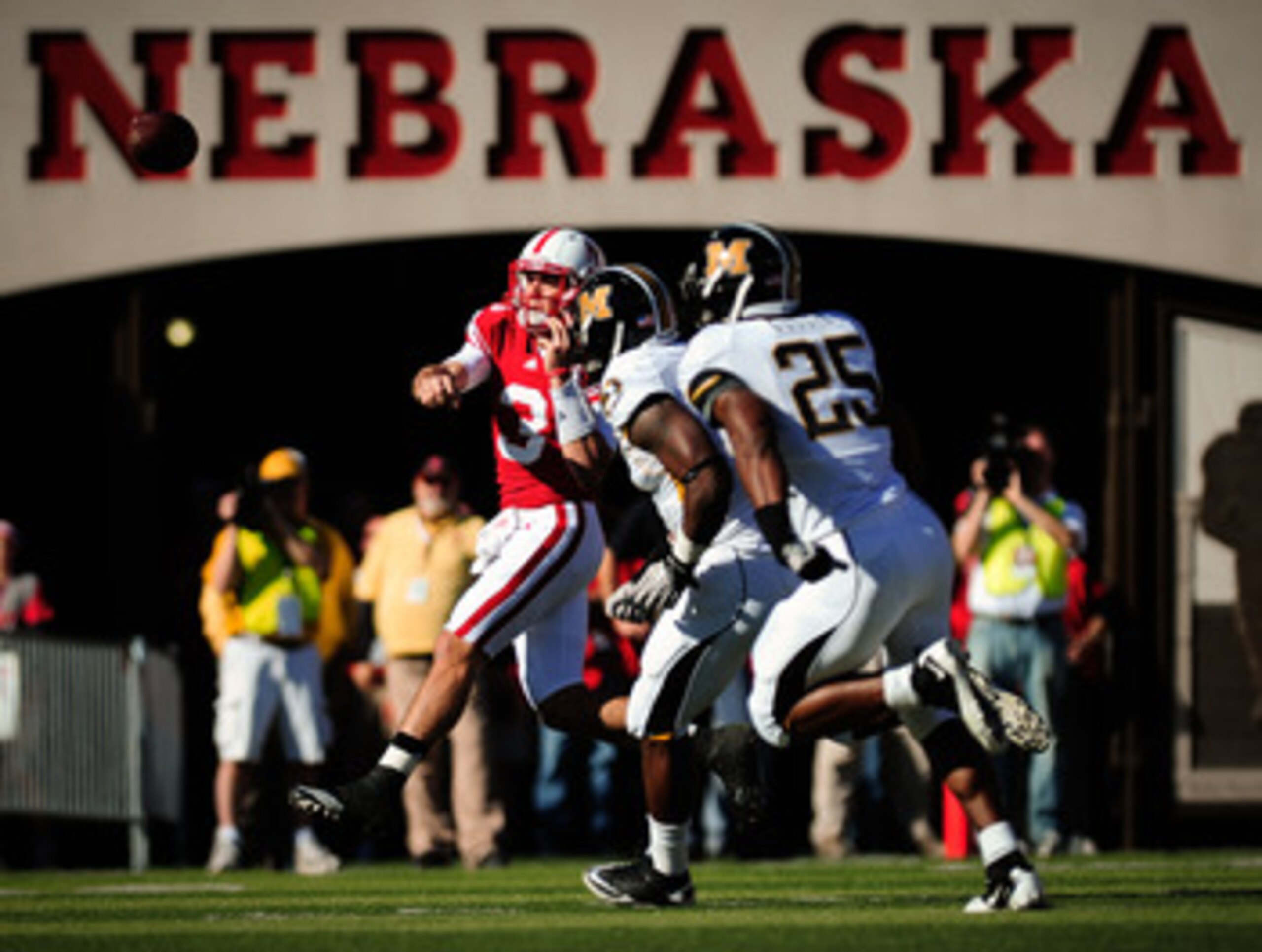 LINCOLN, NE - OCTOBER 30: Quarterback Taylor Martinez #3 of the Nebraska Cornhuskers throws over the Missouri Tigers defense during first half action of their game at Memorial Stadium on October 30, 2010 in Lincoln, Nebraska. Nebraska Defeated Missouri 31