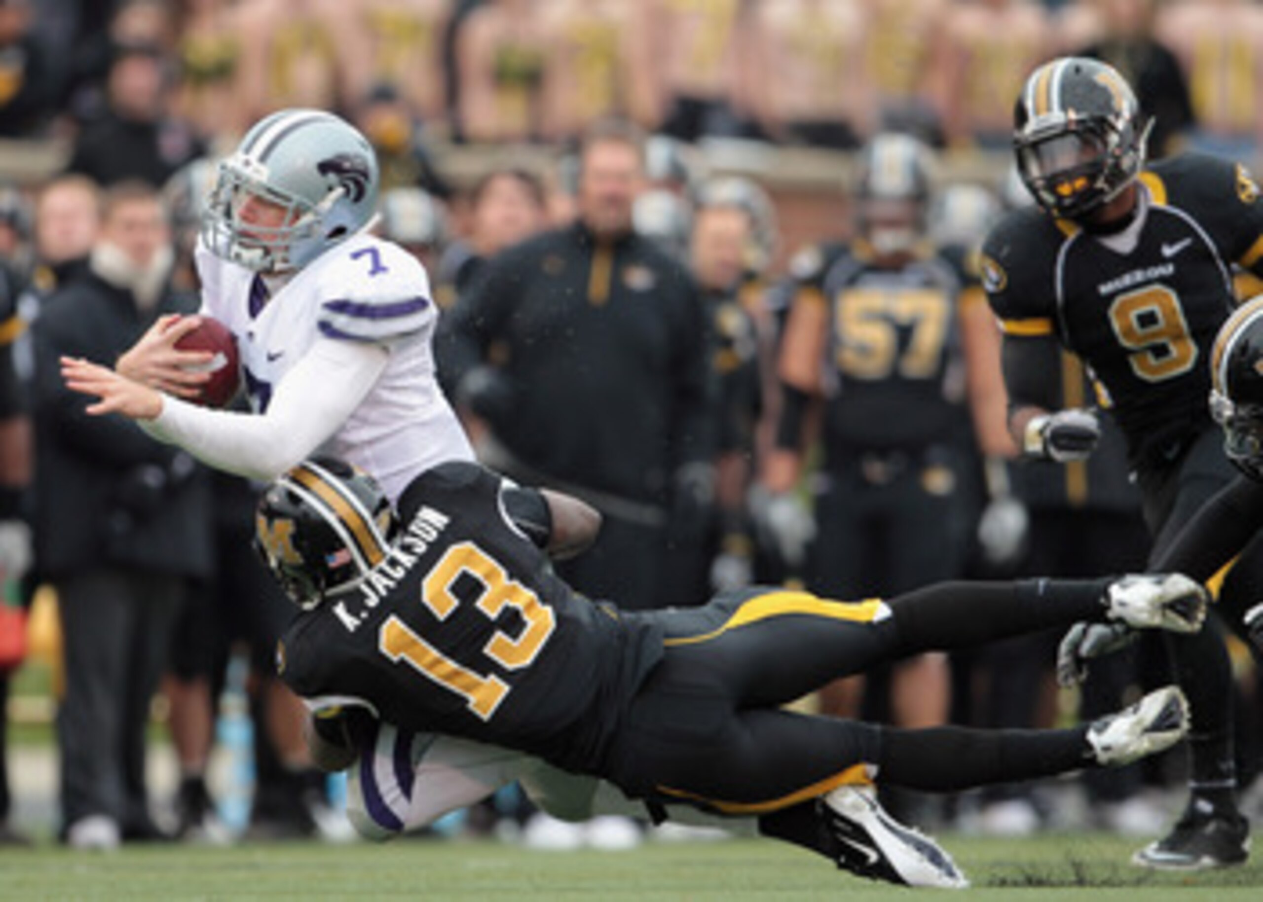 COLUMBIA, MO - NOVEMBER 13:  Quarterback Collin Klein #7 of the Kansas State Wildcats carries the ball as Kenji Jackson #13 of the Missouri Tigers defends during the game on November 13, 2010 at Faurot Field/Memorial Stadium in Columbia, Missouri.  (Photo