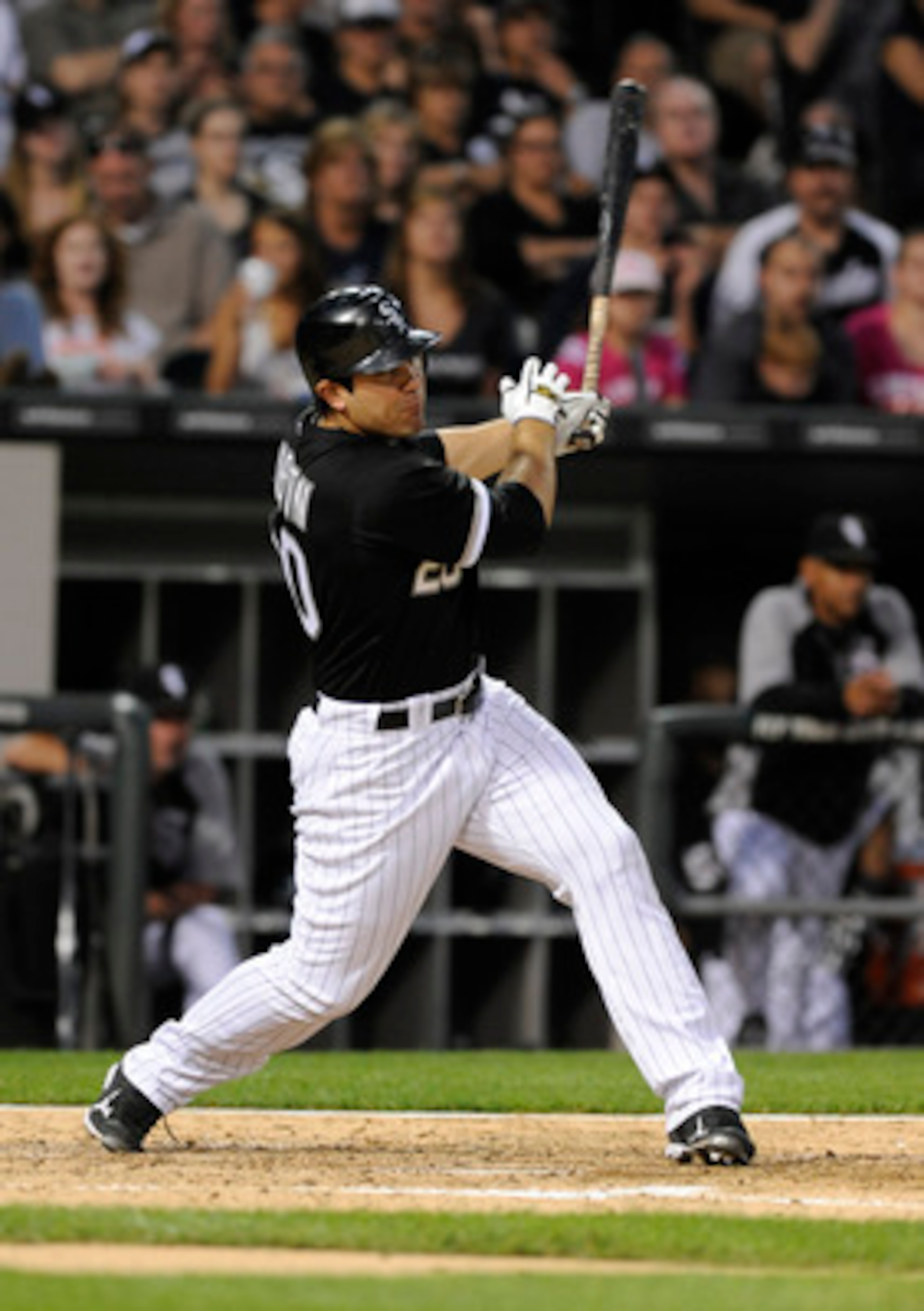 CHICAGO, IL - JUNE 03: Carlos Quentin #20 of the Chicago White Sox hits a three-run homer against the Detroit Tigers in the fourth inning on June 3, 2011 at U.S. Cellular Field in Chicago, Illinois.  (Photo by David Banks/Getty Images)