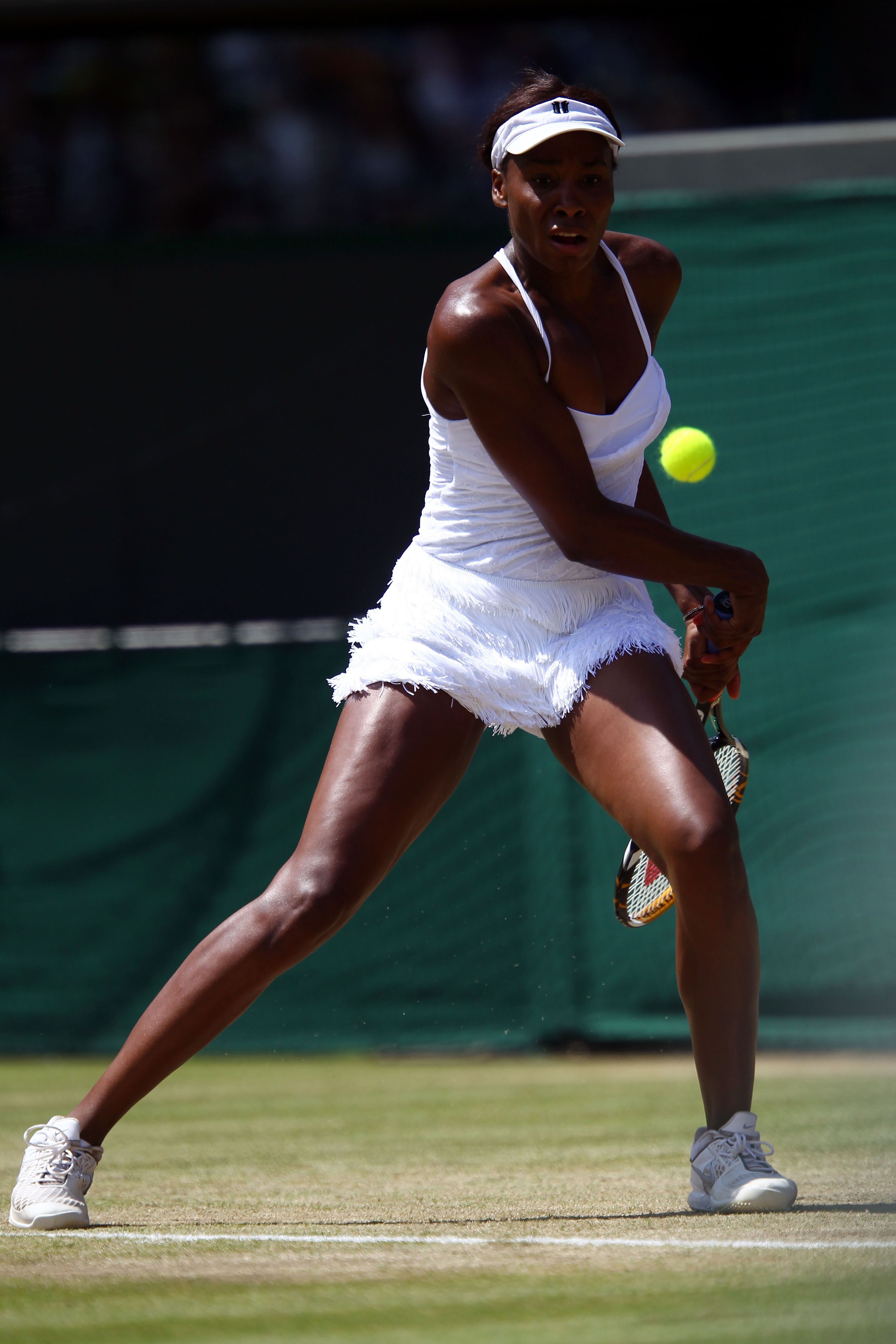 LONDON, ENGLAND - JUNE 29:  Venus Williams of USA in action during her Quarter Final match against Tsvetana Pironkova of Bulgaria on Day Eight of the Wimbledon Lawn Tennis Championships at the All England Lawn Tennis and Croquet Club on June 29, 2010 in L