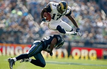SEATTLE , WA - SEPTEMBER 13: Donnie Avery #17 of the St. Louis Rams leaps over Josh Wilson #26 of the Seattle Seahawks at Qwest Field on September 13, 2009 in Seattle, Washington. (Photo by Jonathan Ferrey/Getty Images) SEATTLE , WA - SEPTEMBER 13: Donnie Avery #17 of the St. Louis Rams leaps over Josh Wilson #26 of the Seattle Seahawks at Qwest Field on September 13, 2009 in Seattle, Washington. (Photo by Jonathan Ferrey/Getty Images)