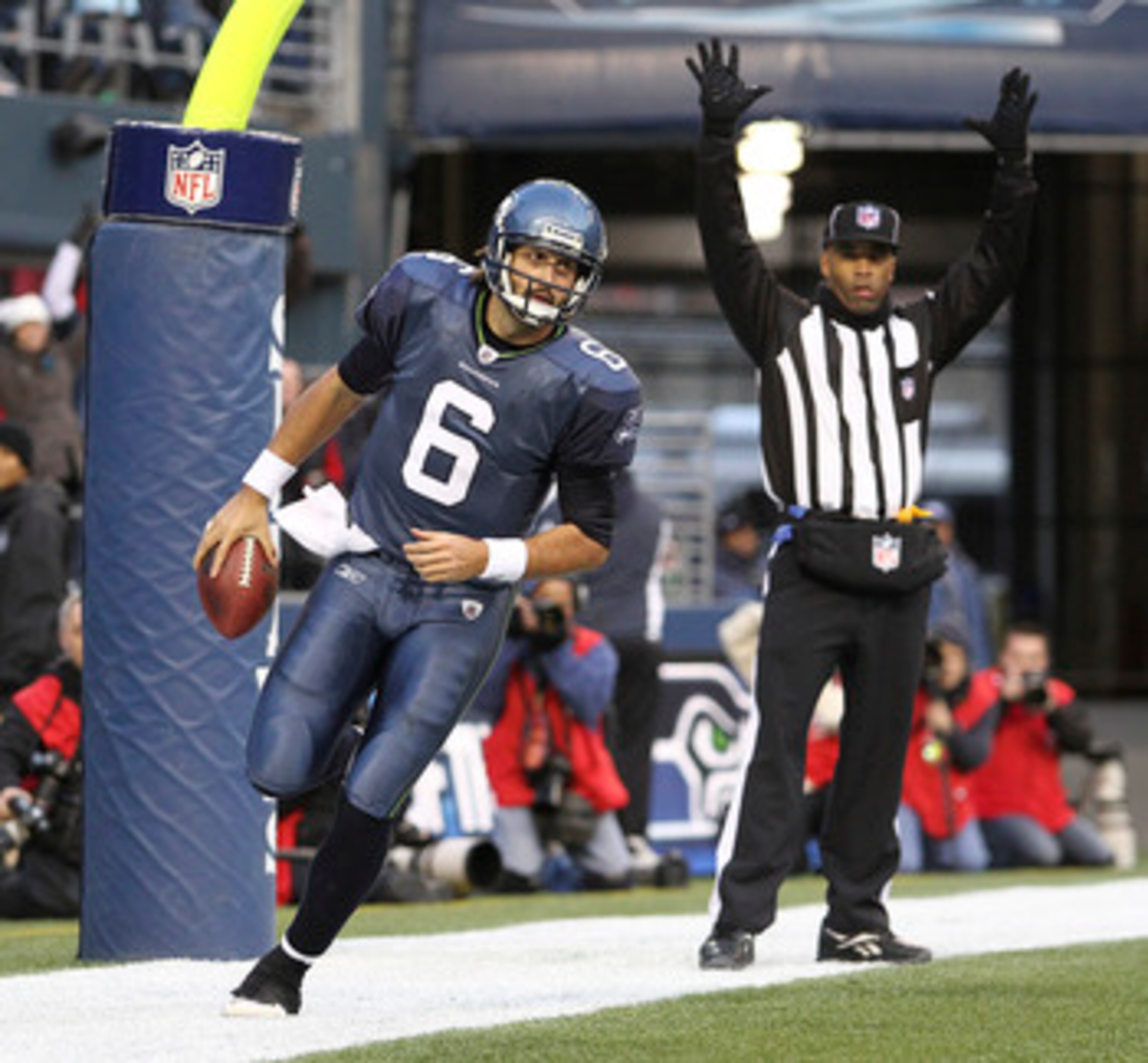 SEATTLE, WA - DECEMBER 19: Quarterback Charlie Whitehurst #6 of the Seattle Seahawks scores a touchdown against the Atlanta Falcons at Qwest Field on December 19, 2010 in Seattle, Washington. The Falcons defeated the Seahawks 34-18. (Photo by Otto Greule SEATTLE, WA - DECEMBER 19: Quarterback Charlie Whitehurst #6 of the Seattle Seahawks scores a touchdown against the Atlanta Falcons at Qwest Field on December 19, 2010 in Seattle, Washington. The Falcons defeated the Seahawks 34-18. (Photo by Otto Greule