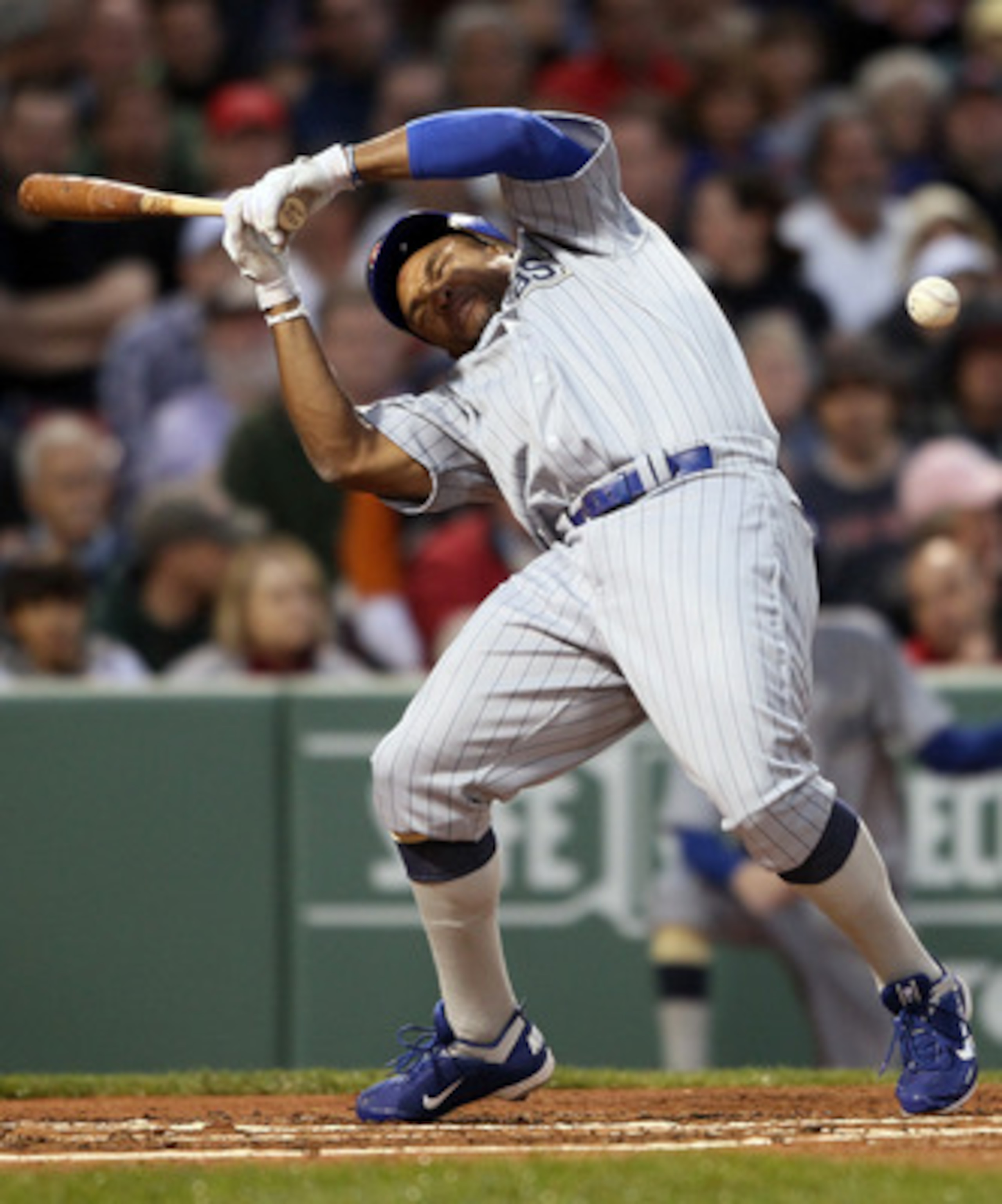 BOSTON, MA - MAY 21:  Marlon Byrd #24 of the Chicago Cubs is hits a in the head by a pitch in the second inning against the Boston Red Sox  on May 21, 2011 at Fenway Park in Boston, Massachusetts. Tonight the Chicago Cubs and the Boston Red Sox are wearin
