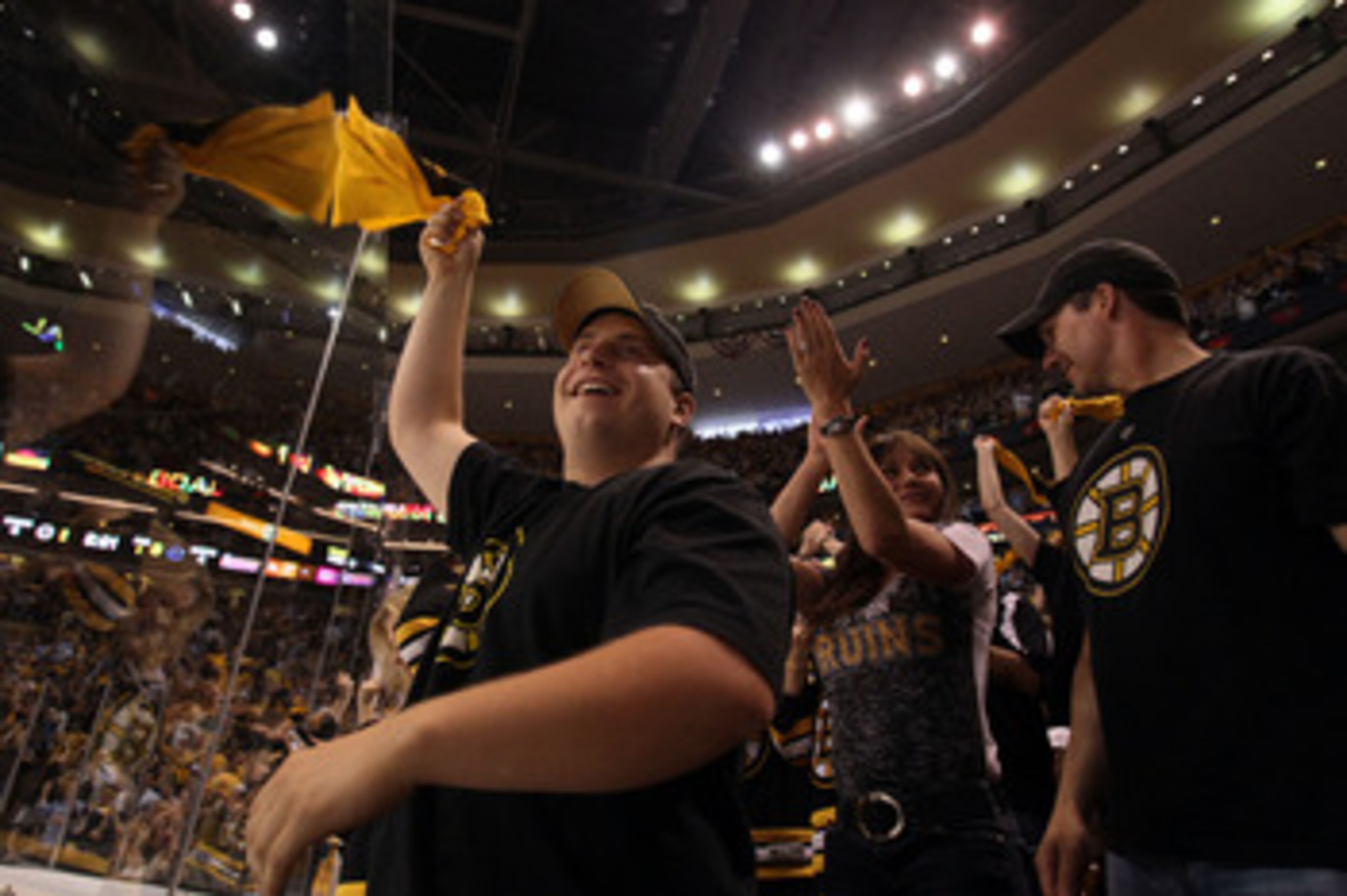 BOSTON, MA - JUNE 08:  Boston Bruins fans cheer during Game Four against the Vancouver Canucks in the 2011 NHL Stanley Cup Final at TD Garden on June 8, 2011 in Boston, Massachusetts.  (Photo by Elsa/Getty Images)